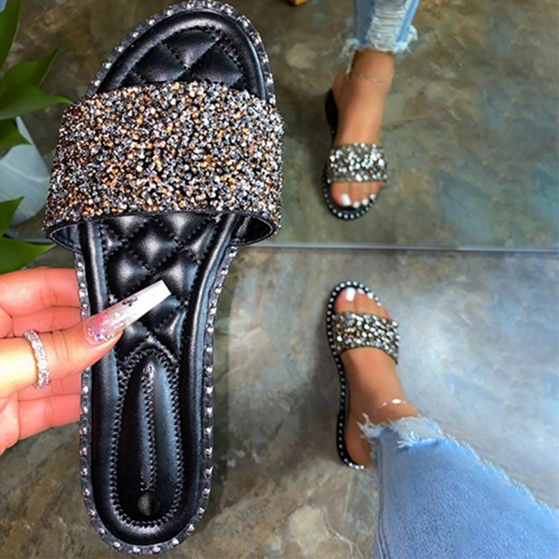 A pair of stylish Crystal Women Slippers featuring bling bling embellishments, perfect for summer beach outings. Lightweight and comfortable design.