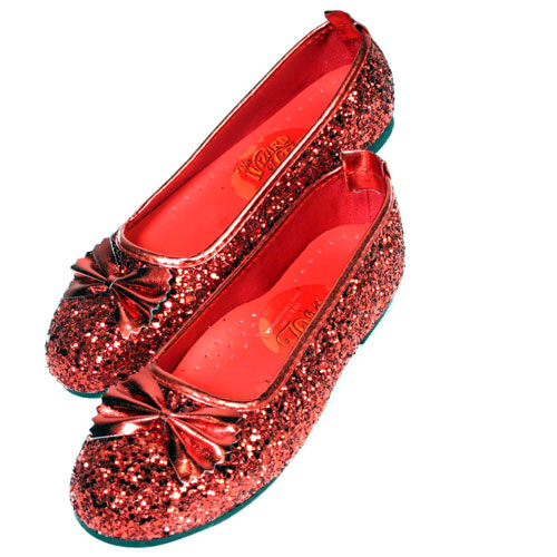 Child-sized red glitter Ruby Slippers with a stylish bow, inspired by Wizard of Oz.