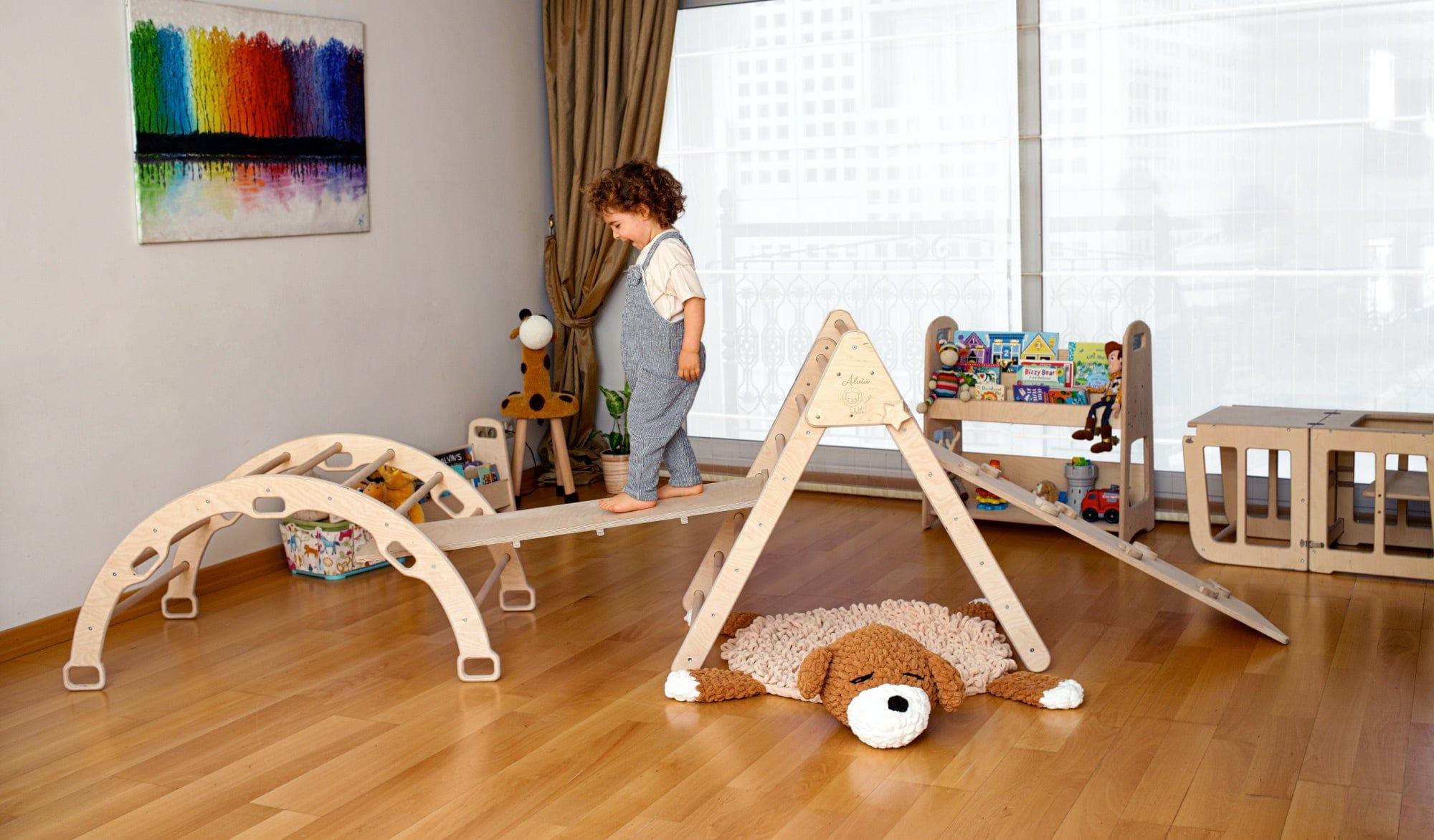 4 Pieces Montessori Climbing Set featuring a climbing triangle, arch/rocker, ladder, and sliding ramps made from natural birch plywood.