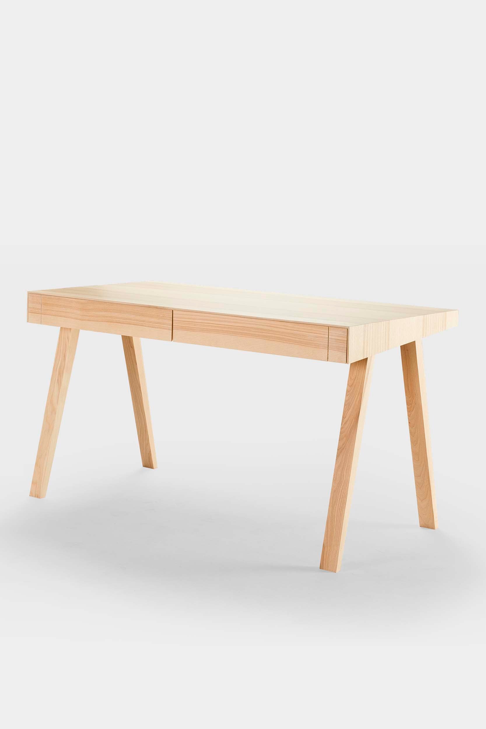 The 4.9 Desk by Marius Valaitis featuring a unique design with a storage slit and smooth surface, showcasing modern elegance and functionality.