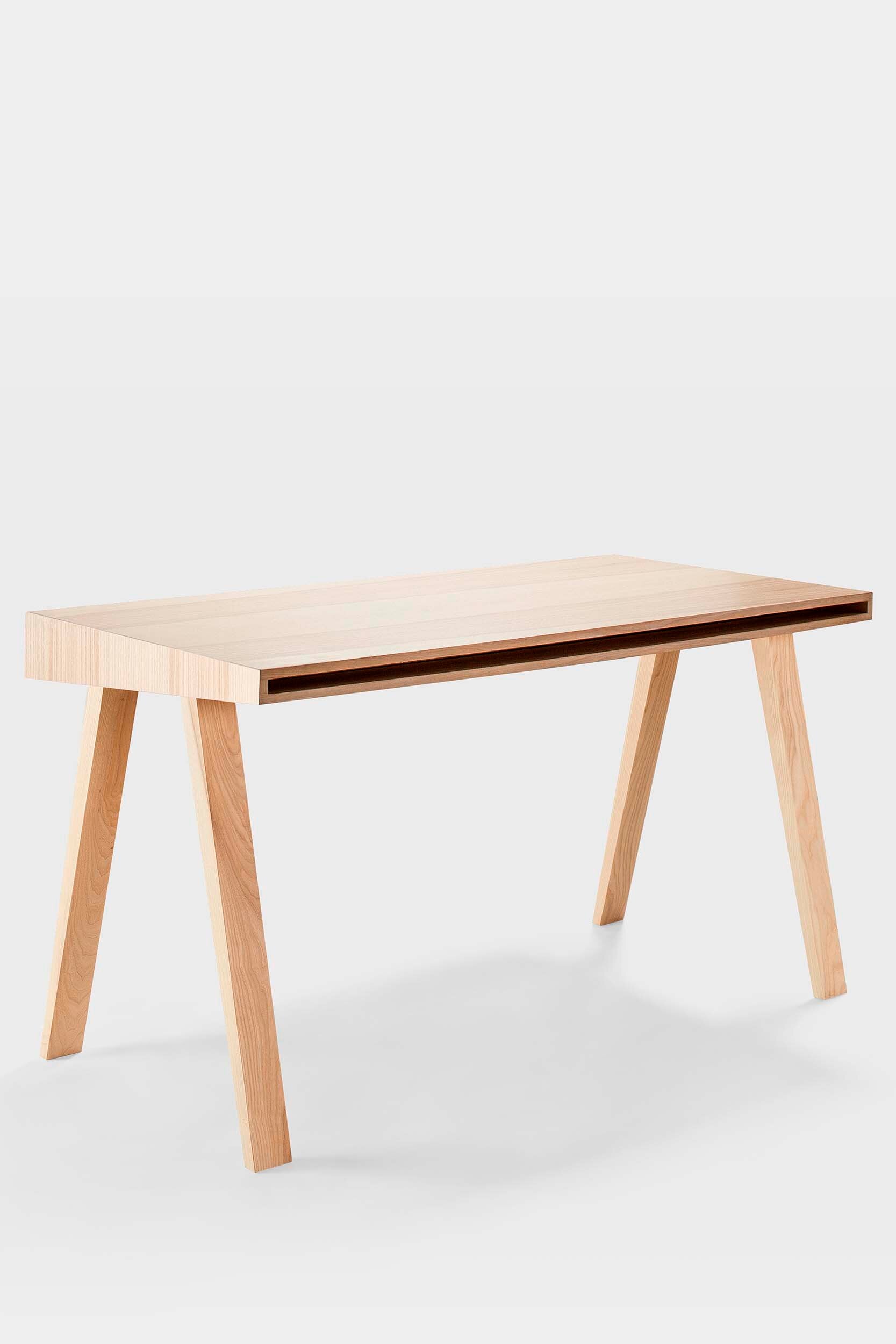 The 4.9 Desk by Marius Valaitis featuring a unique design with a storage slit and smooth surface, showcasing modern elegance and functionality.