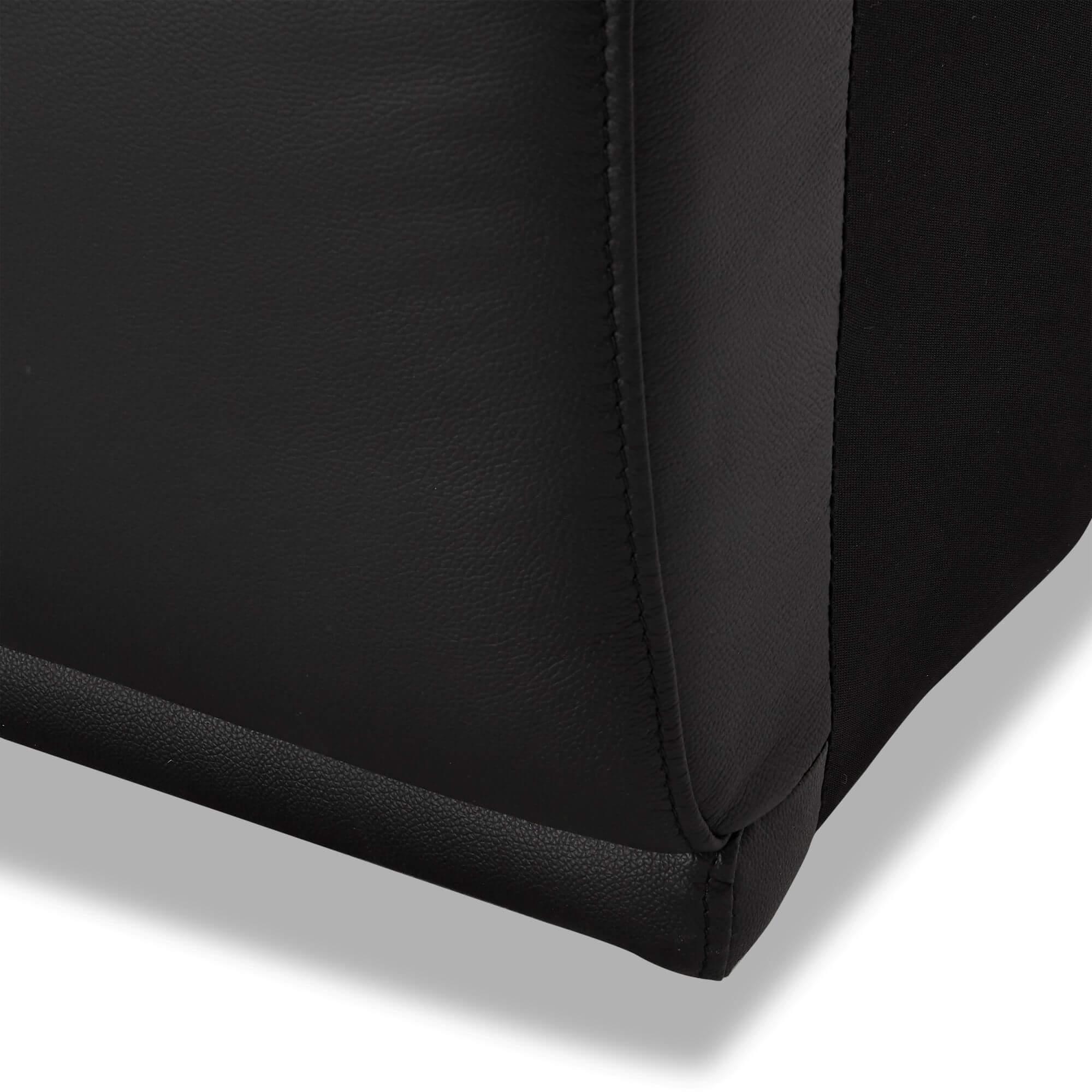 Armless sofa module in black leather, showcasing modern design and rich foam padding.