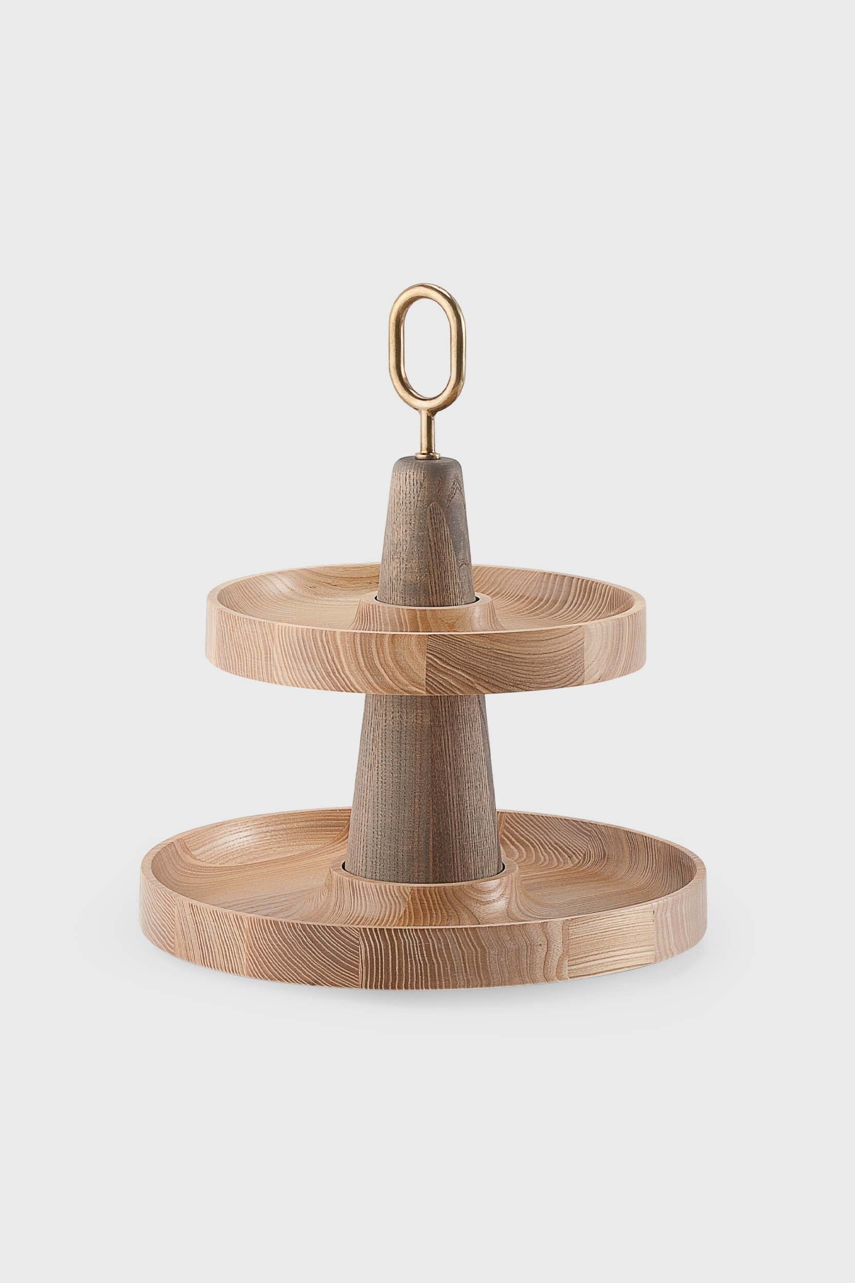 Babel Serving Stand featuring two scooped wooden plates and a brass handle, elegantly designed for serving fruits and desserts.