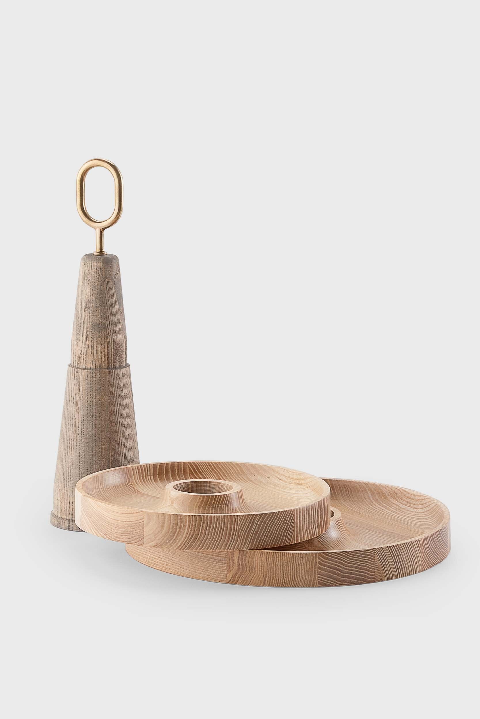 Babel Serving Stand featuring two scooped wooden plates and a brass handle, elegantly designed for serving fruits and desserts.