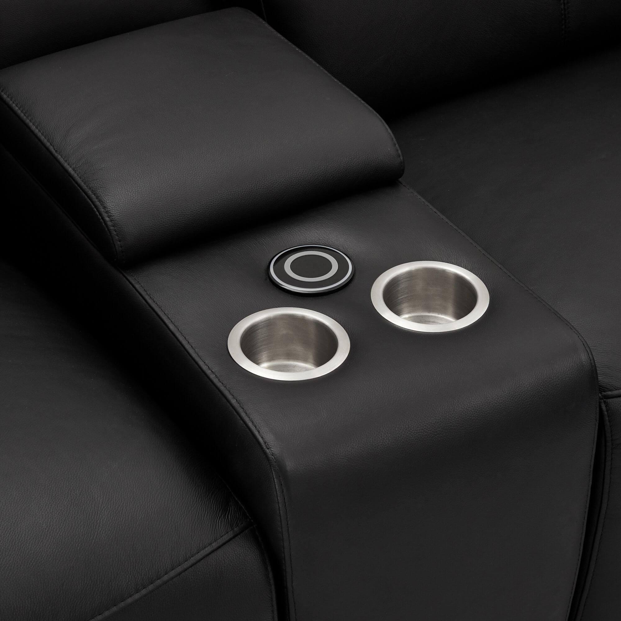 Elegant black leather bar sofa module with cupholders and wireless charger, featuring soft padded armrests.