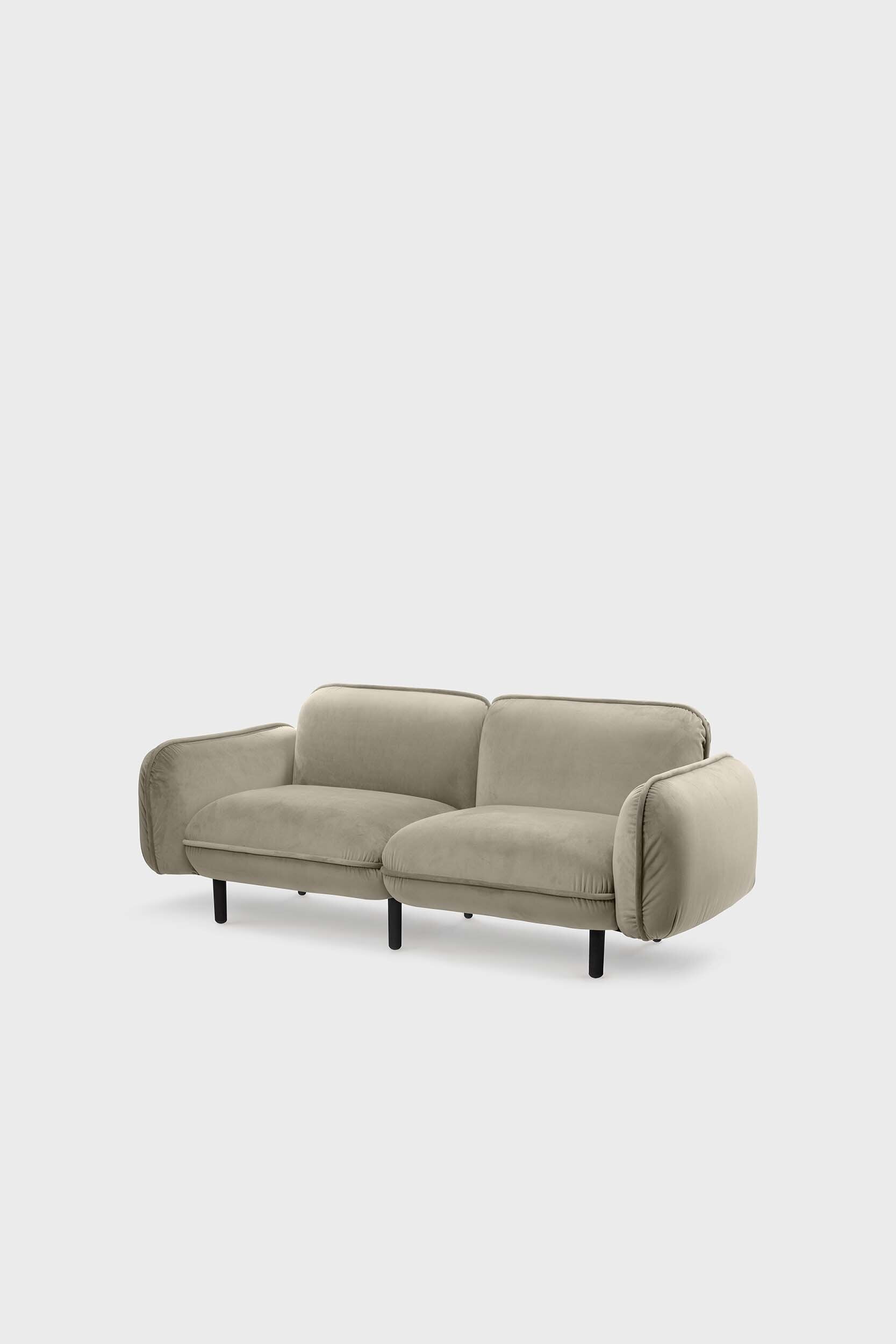 Bean modular sofa with rounded corners, elegant wooden legs, and soft pleated velour fabric in five color options.