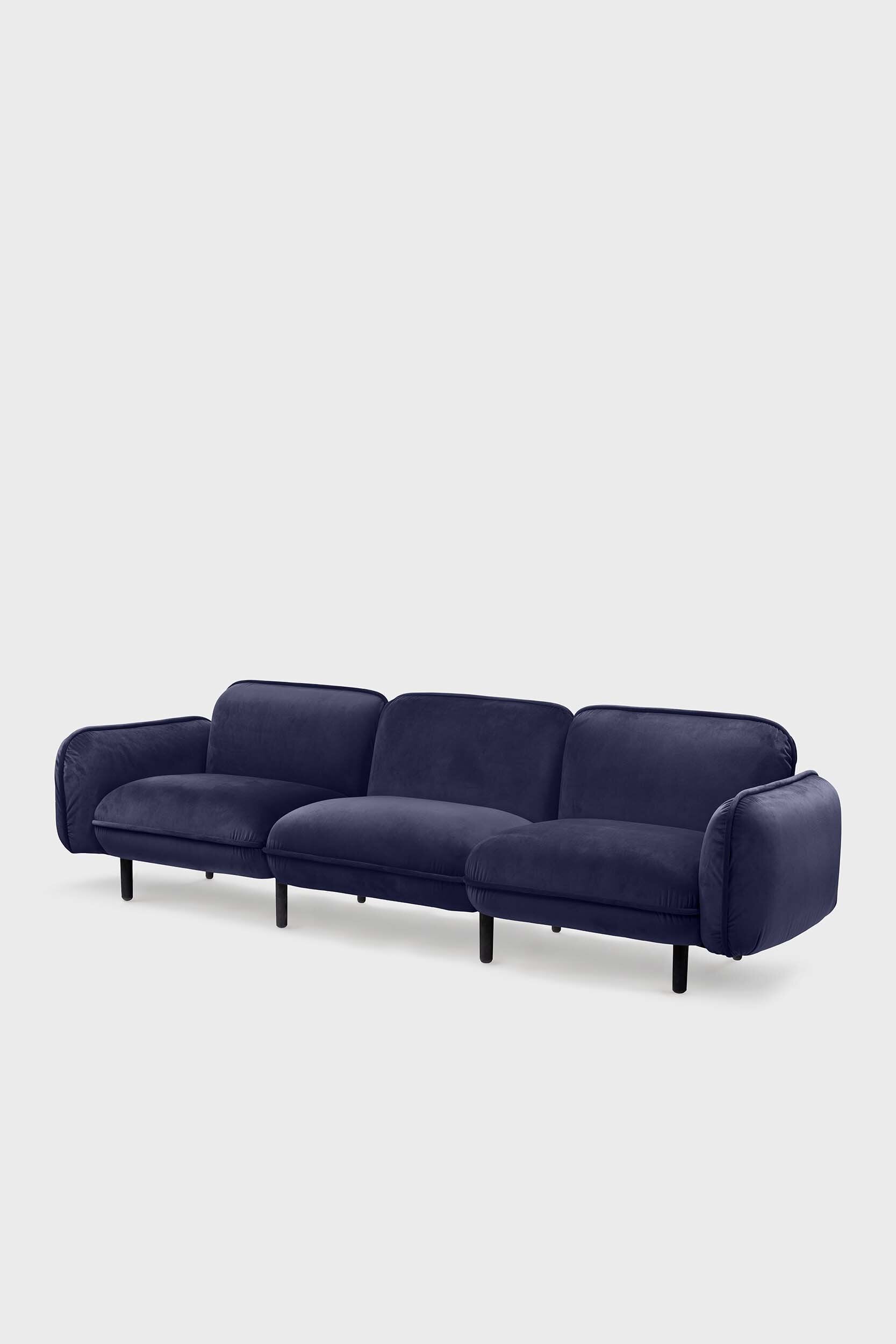 Bean modular sofa with rounded corners, elegant wooden legs, and soft pleated velour fabric in five color options.