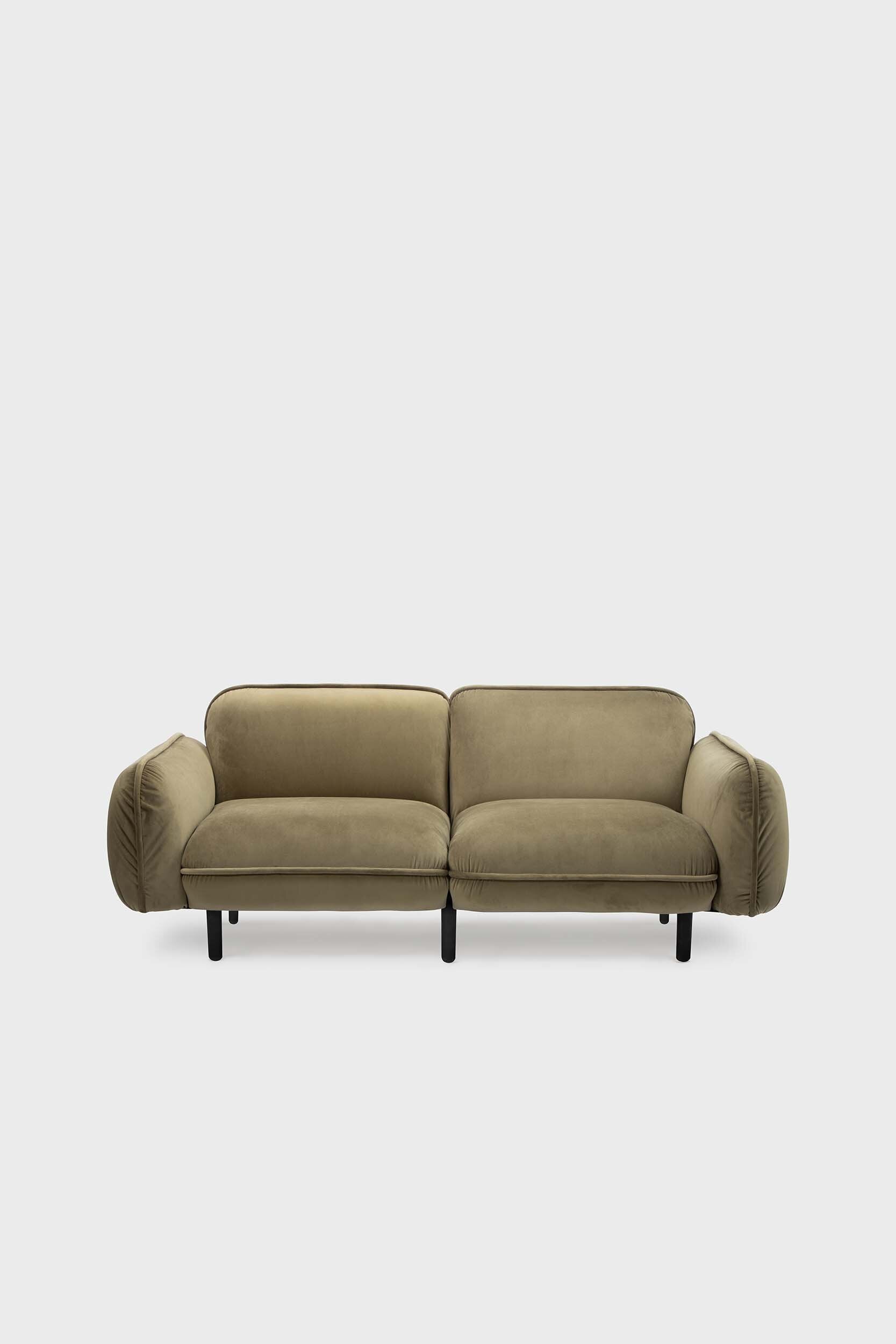 Bean modular sofa with rounded corners, elegant wooden legs, and soft pleated velour fabric in five color options.