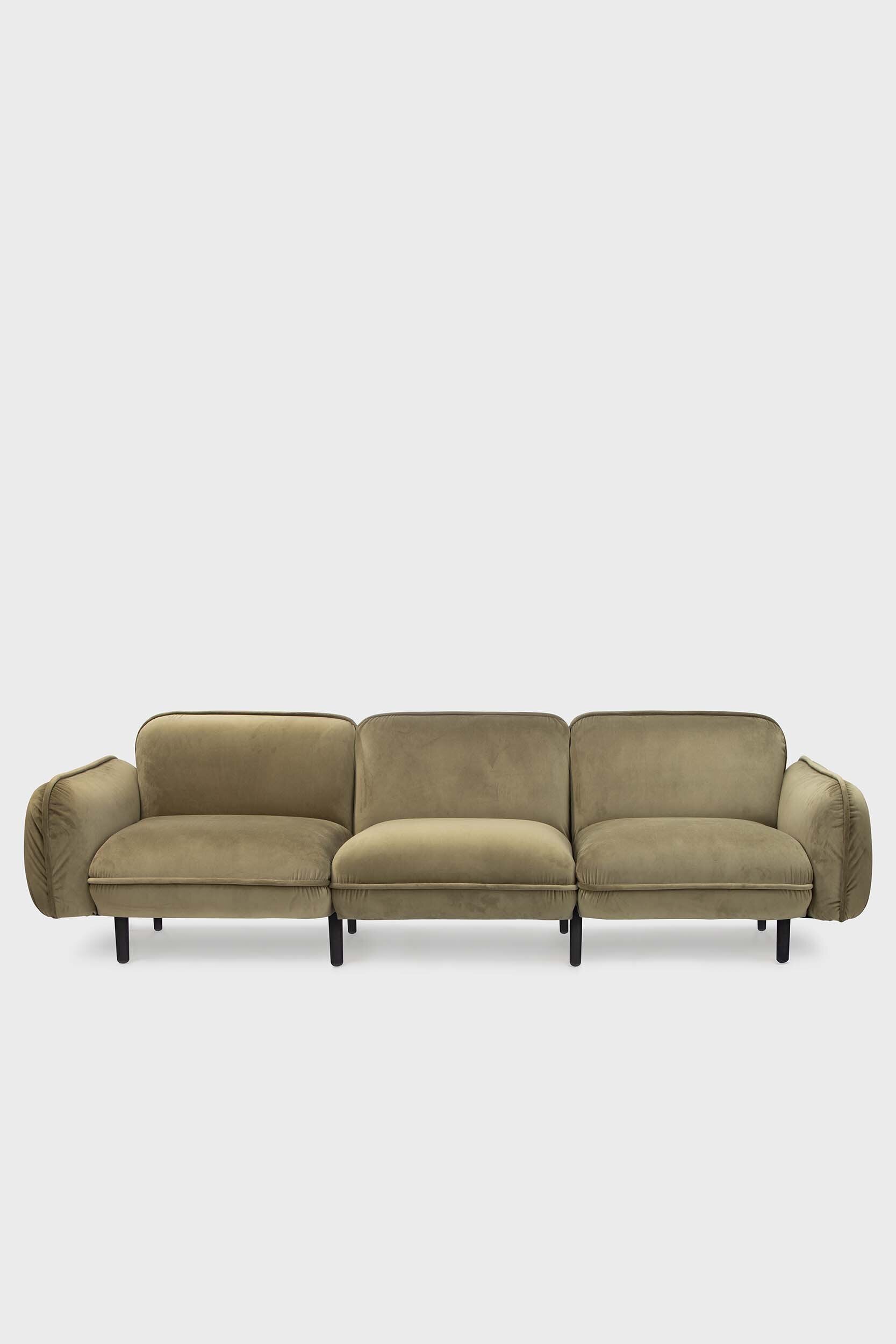 Bean modular sofa with rounded corners, elegant wooden legs, and soft pleated velour fabric in five color options.