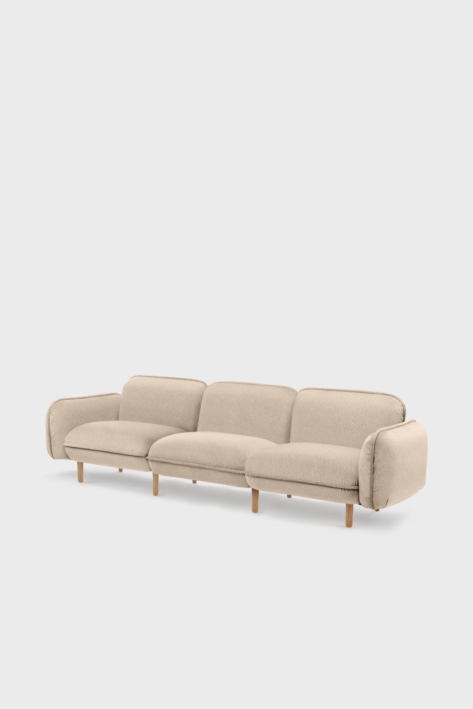 Bean modular sofa with rounded corners, elegant wooden legs, and soft pleated velour fabric in five color options.