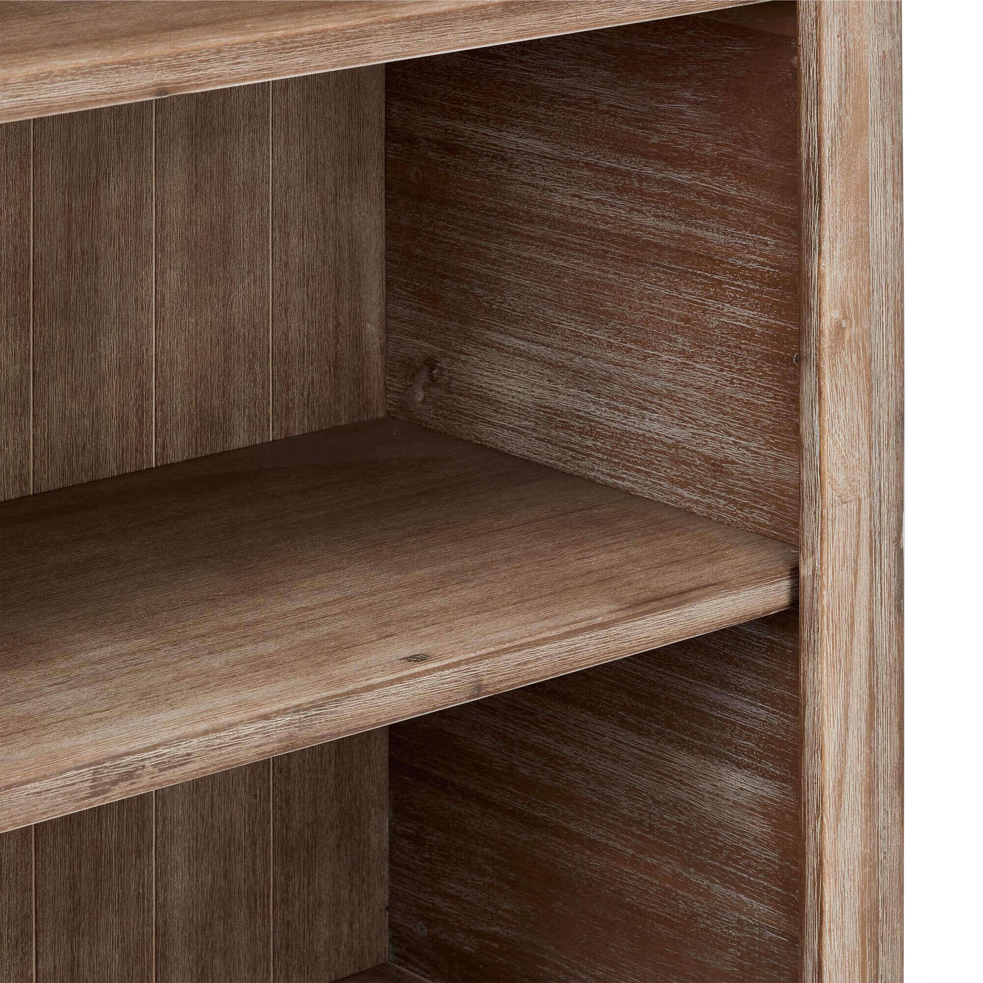 Elegant Bookcase Alaska made of solid acacia wood, showcasing its unique grain and warm tones, perfect for displaying books and decor.