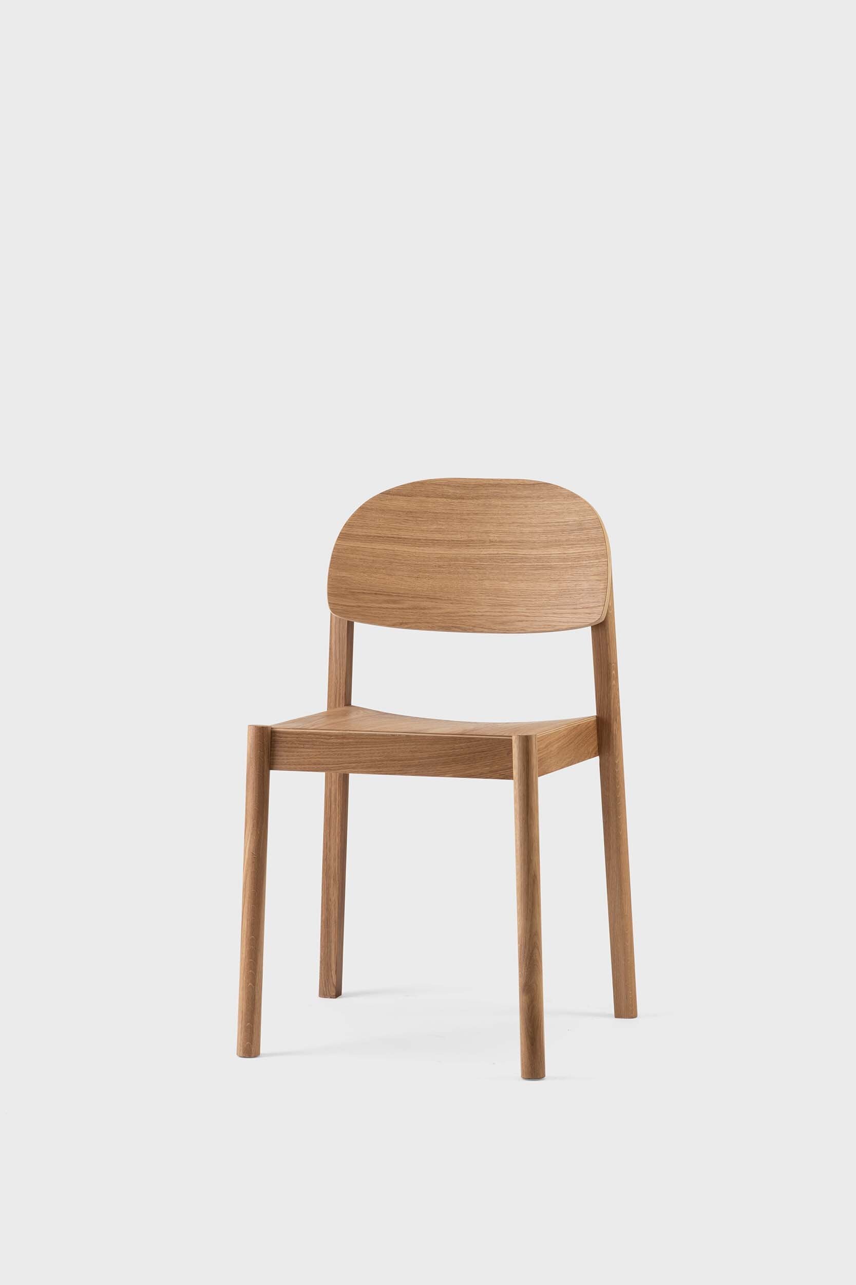 Citizen Dining Chair featuring a minimalist design with rounded legs and a square seat, crafted from sustainable solid oak and veneered plywood.