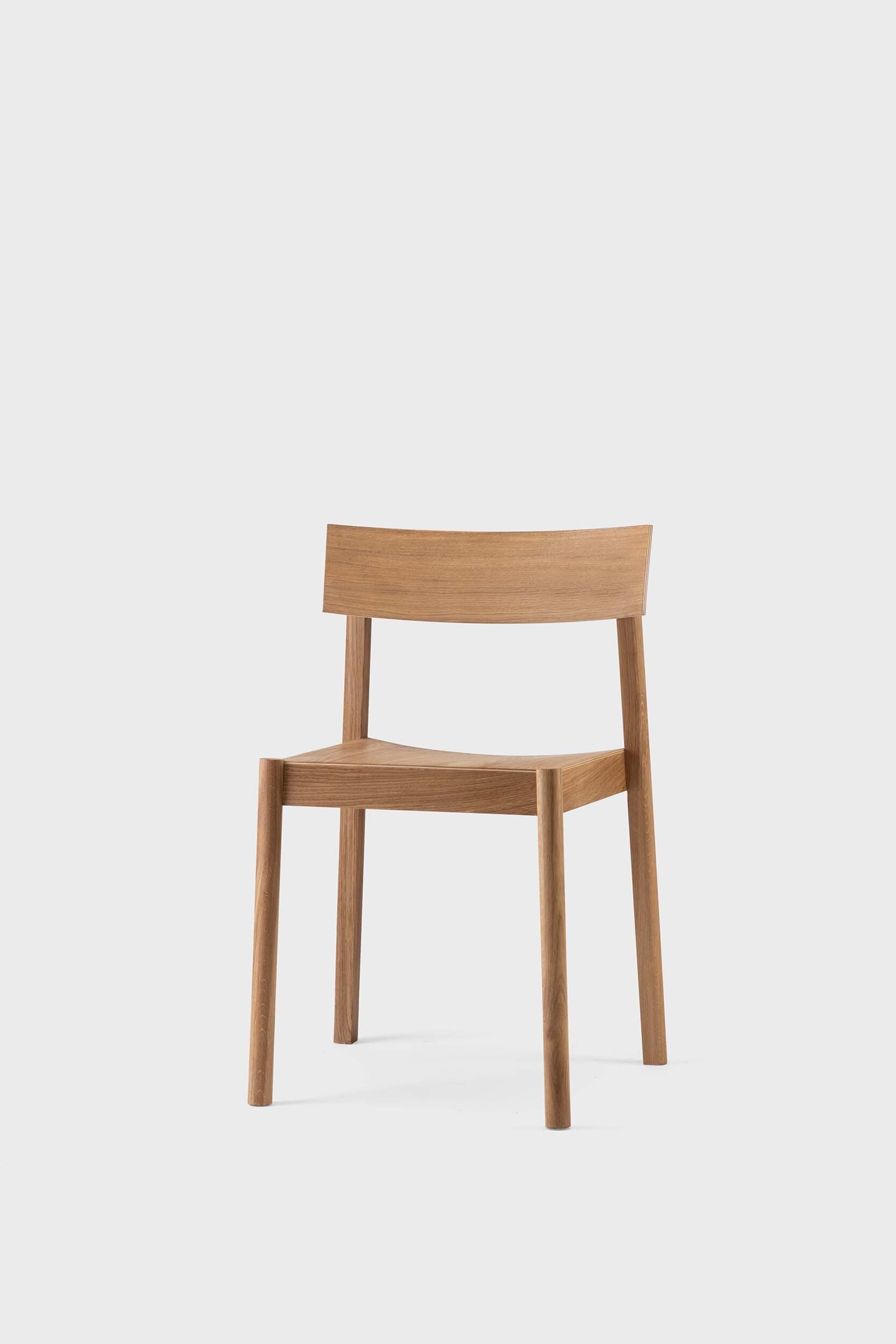 Citizen Dining Chair featuring a minimalist design with rounded legs and a square seat, crafted from sustainable solid oak and veneered plywood.