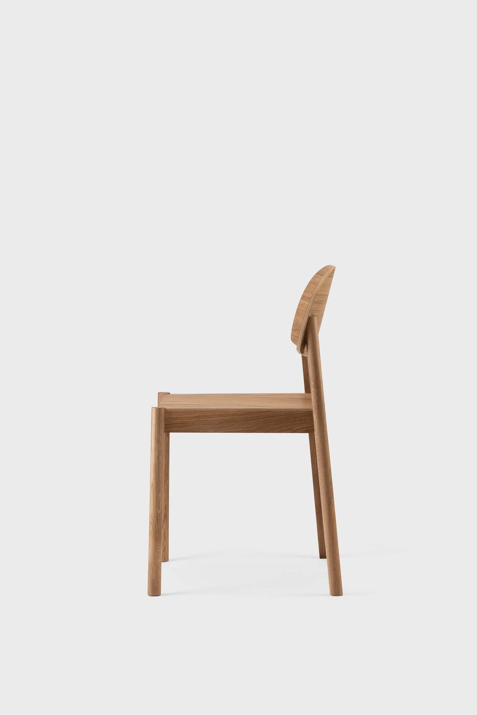 Citizen Dining Chair featuring a minimalist design with rounded legs and a square seat, crafted from sustainable solid oak and veneered plywood.