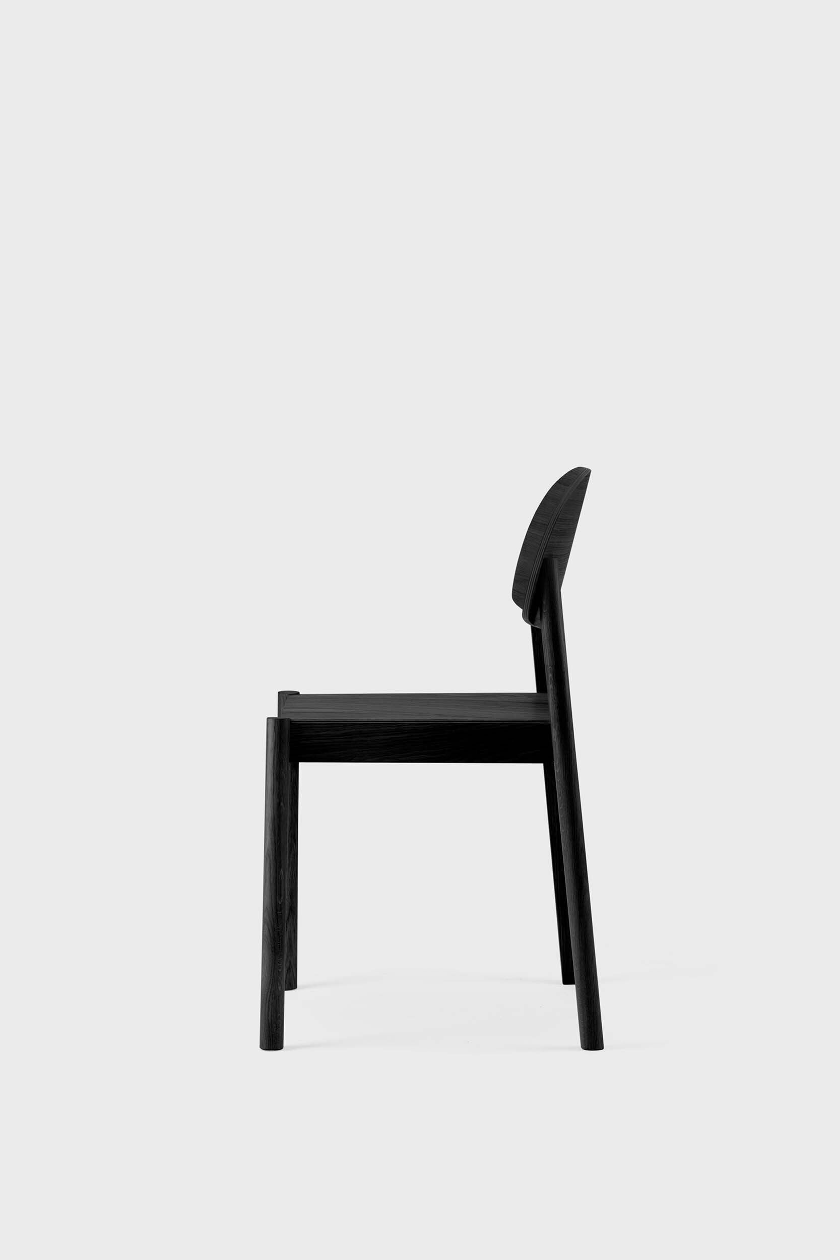 Citizen Dining Chair featuring a minimalist design with rounded legs and a square seat, crafted from sustainable solid oak and veneered plywood.