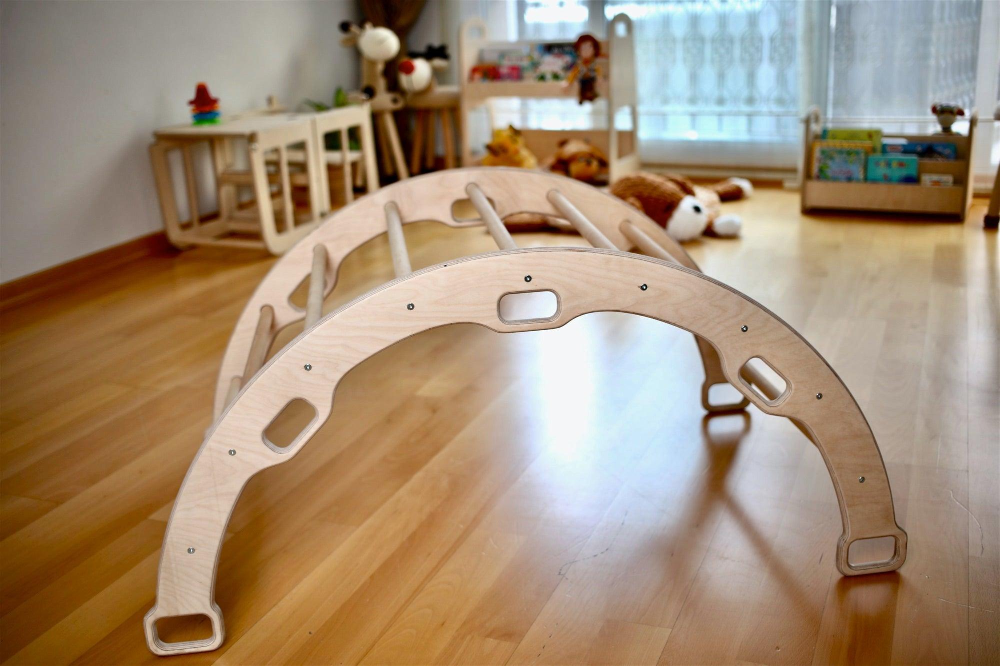 A wooden climbing frame set featuring an arch ladder and ramp, made from natural birch plywood and linden wood, designed for toddlers.