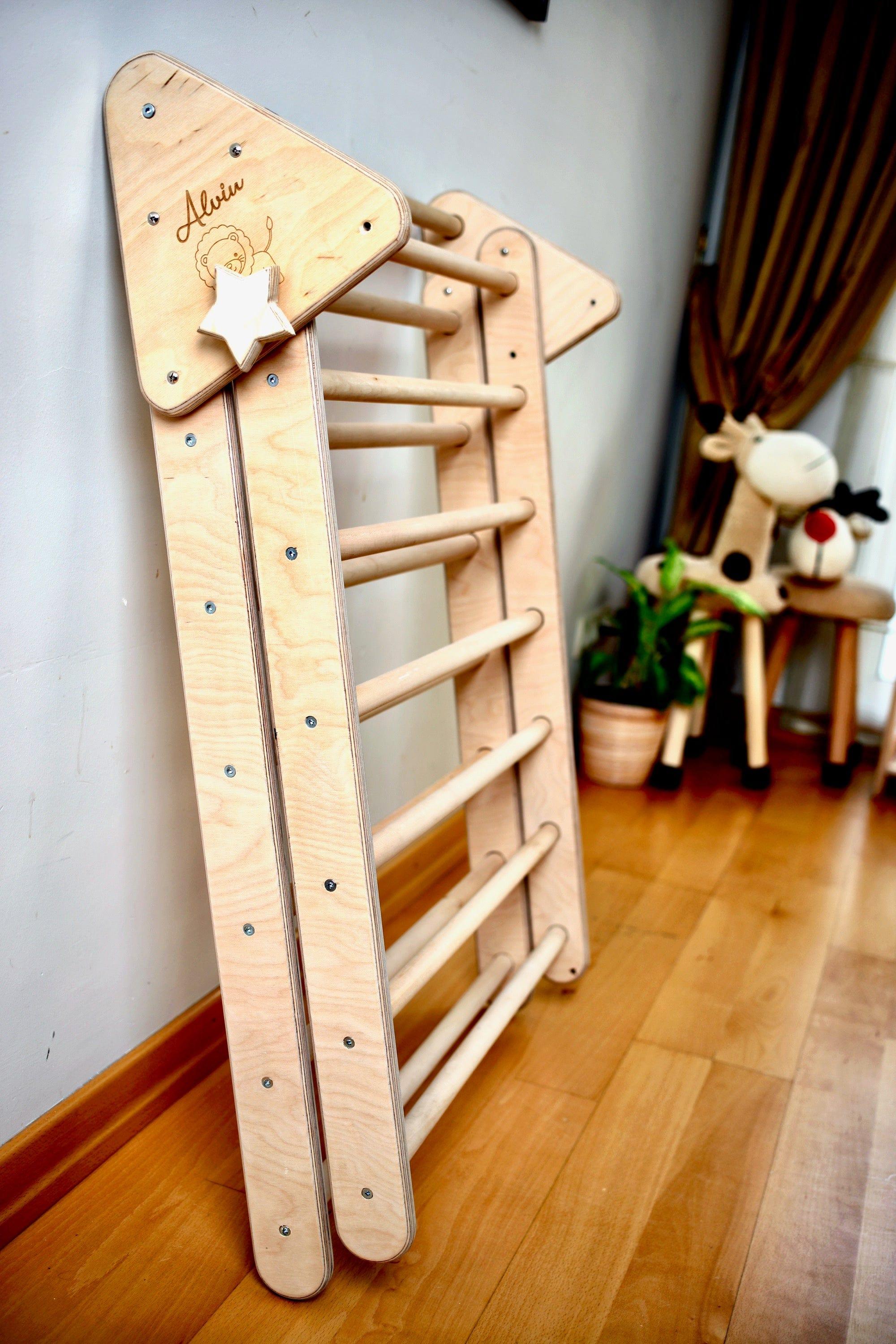 Foldable Climbing Triangle and Ladder Ramp made of natural birch and linden wood, designed for toddlers to enhance motor skills.