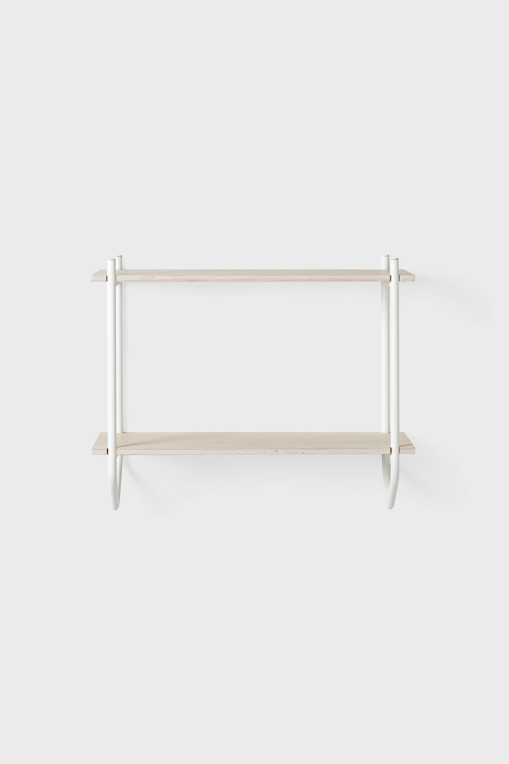 The Dessus Wall Shelf featuring two birch plywood shelves supported by arch metal frames in off white and coal black colors.