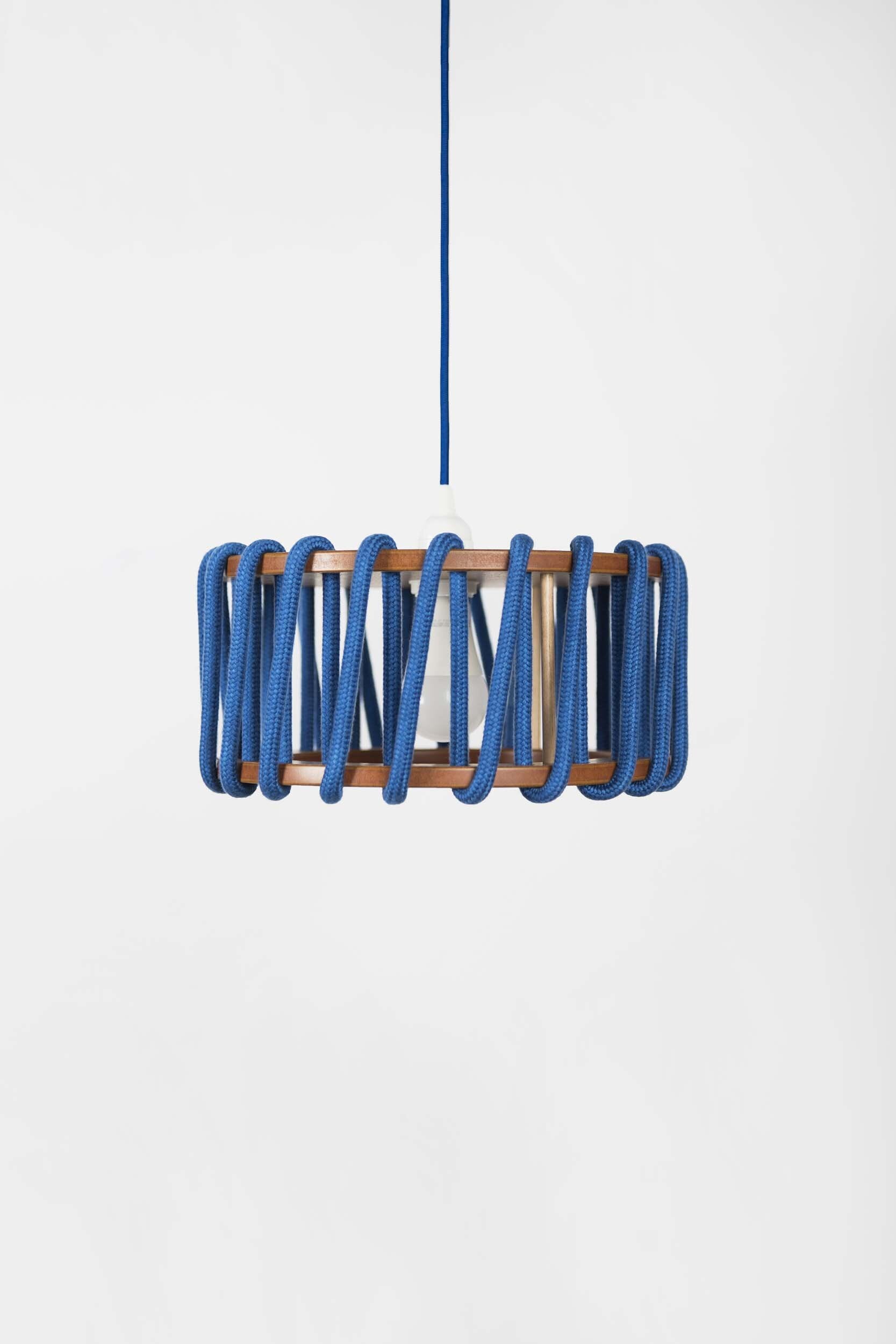 Stylish Macaron Pendant Lamp designed by Silvia Ceñal, featuring wooden elements and a textured cord, perfect for modern interiors.