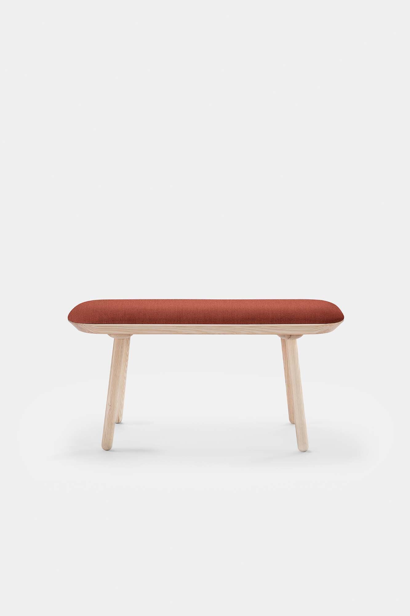 Naïve Bench Upholstered featuring solid wood construction, available in padded and unpadded options, showcasing vibrant colors and sleek design.