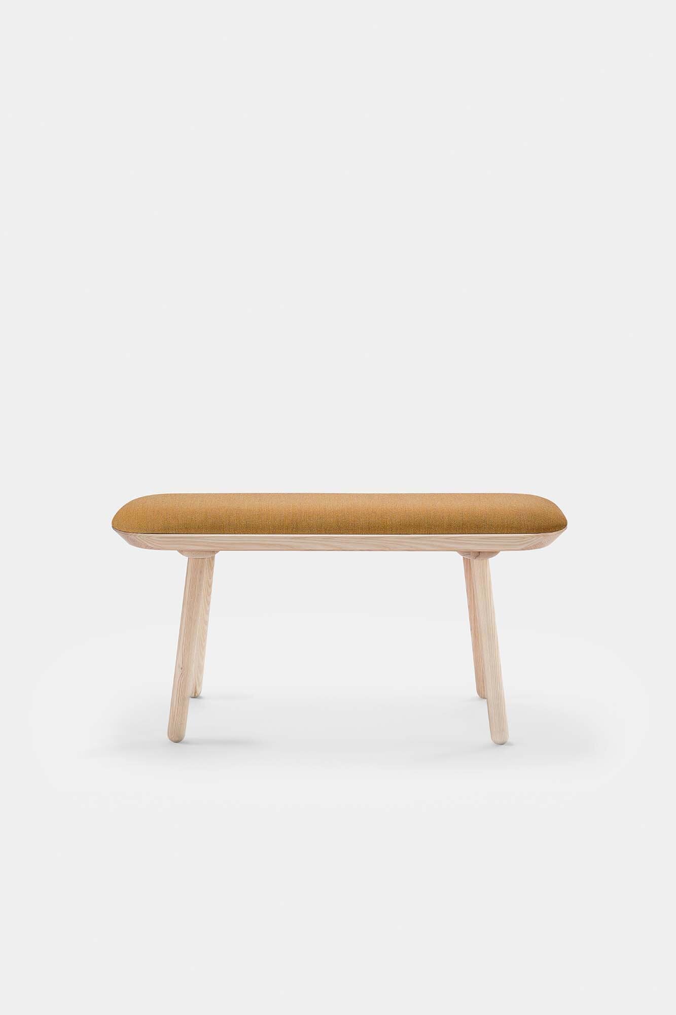 Naïve Bench Upholstered featuring solid wood construction, available in padded and unpadded options, showcasing vibrant colors and sleek design.