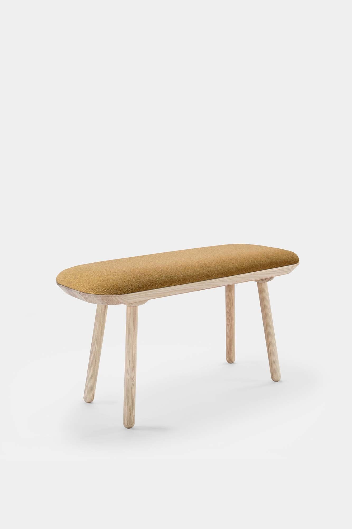 Naïve Bench Upholstered featuring solid wood construction, available in padded and unpadded options, showcasing vibrant colors and sleek design.