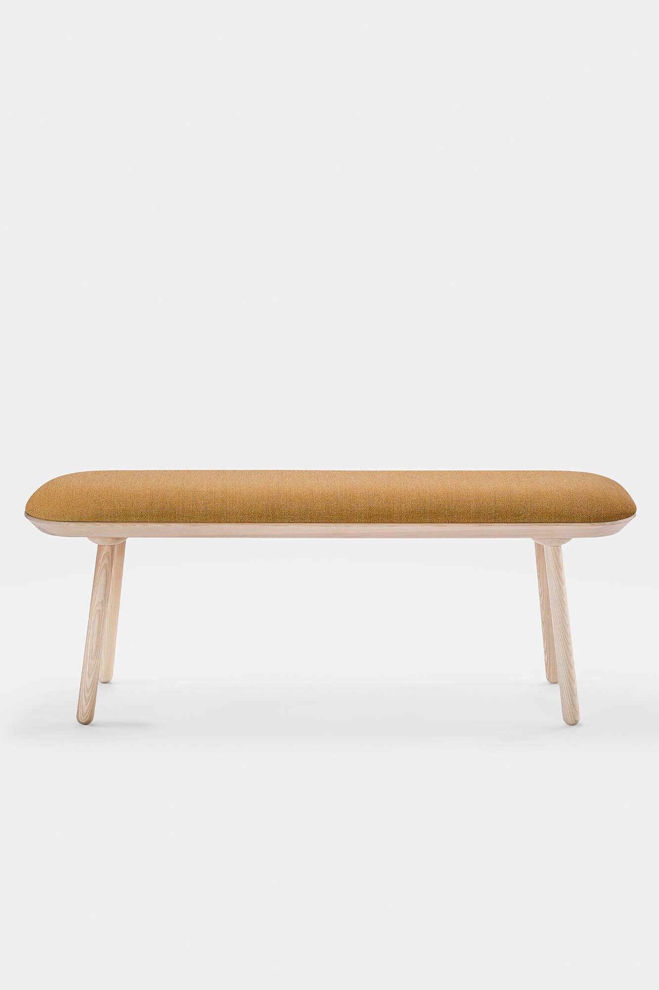 Naïve Bench Upholstered featuring solid wood construction, available in padded and unpadded options, showcasing vibrant colors and sleek design.