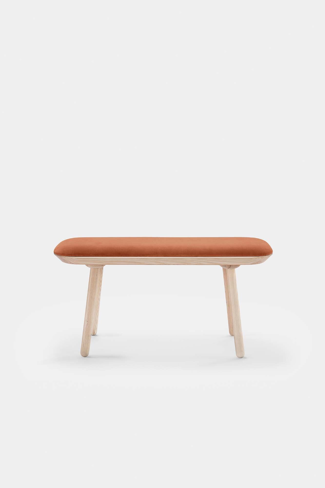 Naïve Bench Upholstered featuring solid wood construction, available in padded and unpadded options, showcasing vibrant colors and sleek design.