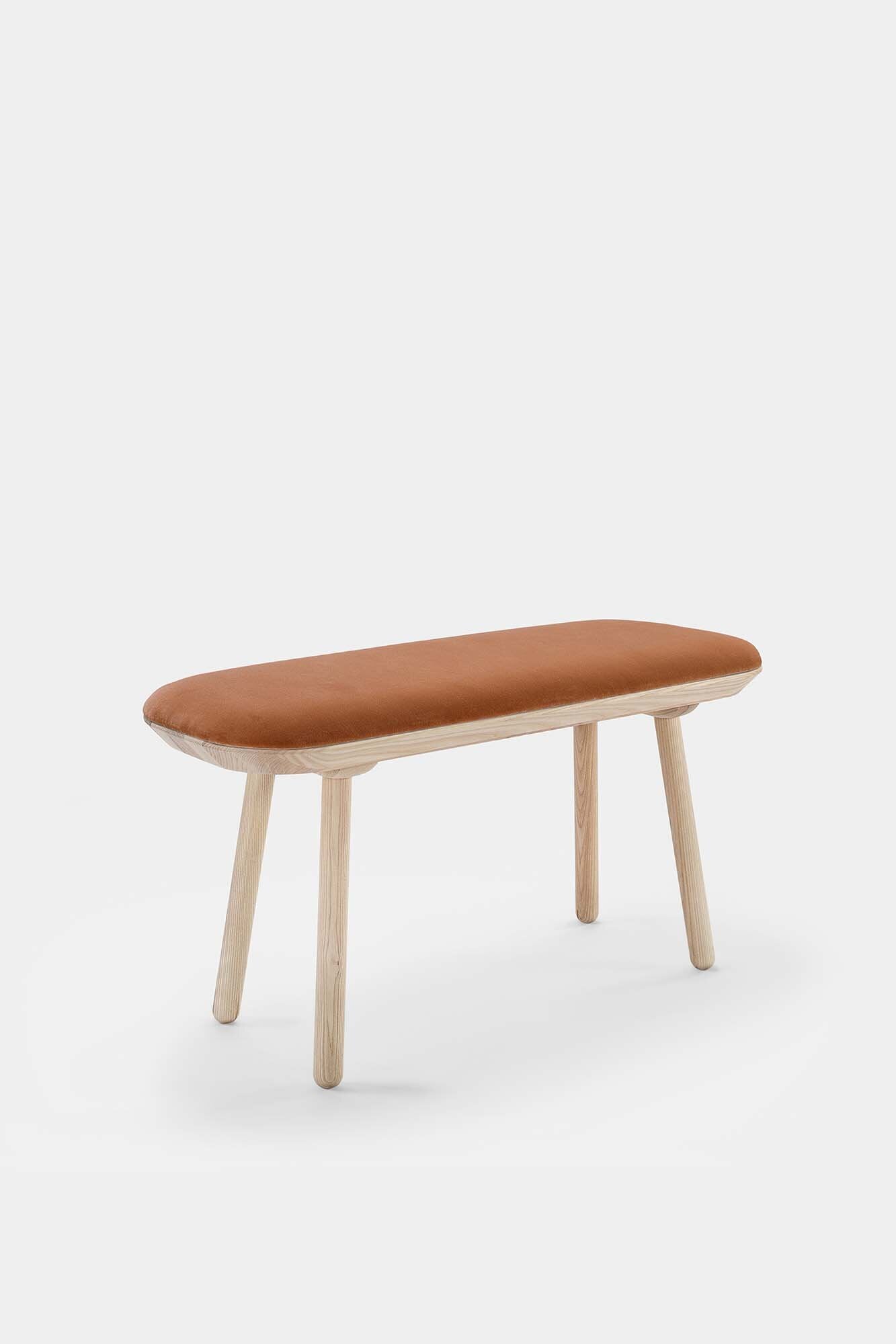 Naïve Bench Upholstered featuring solid wood construction, available in padded and unpadded options, showcasing vibrant colors and sleek design.