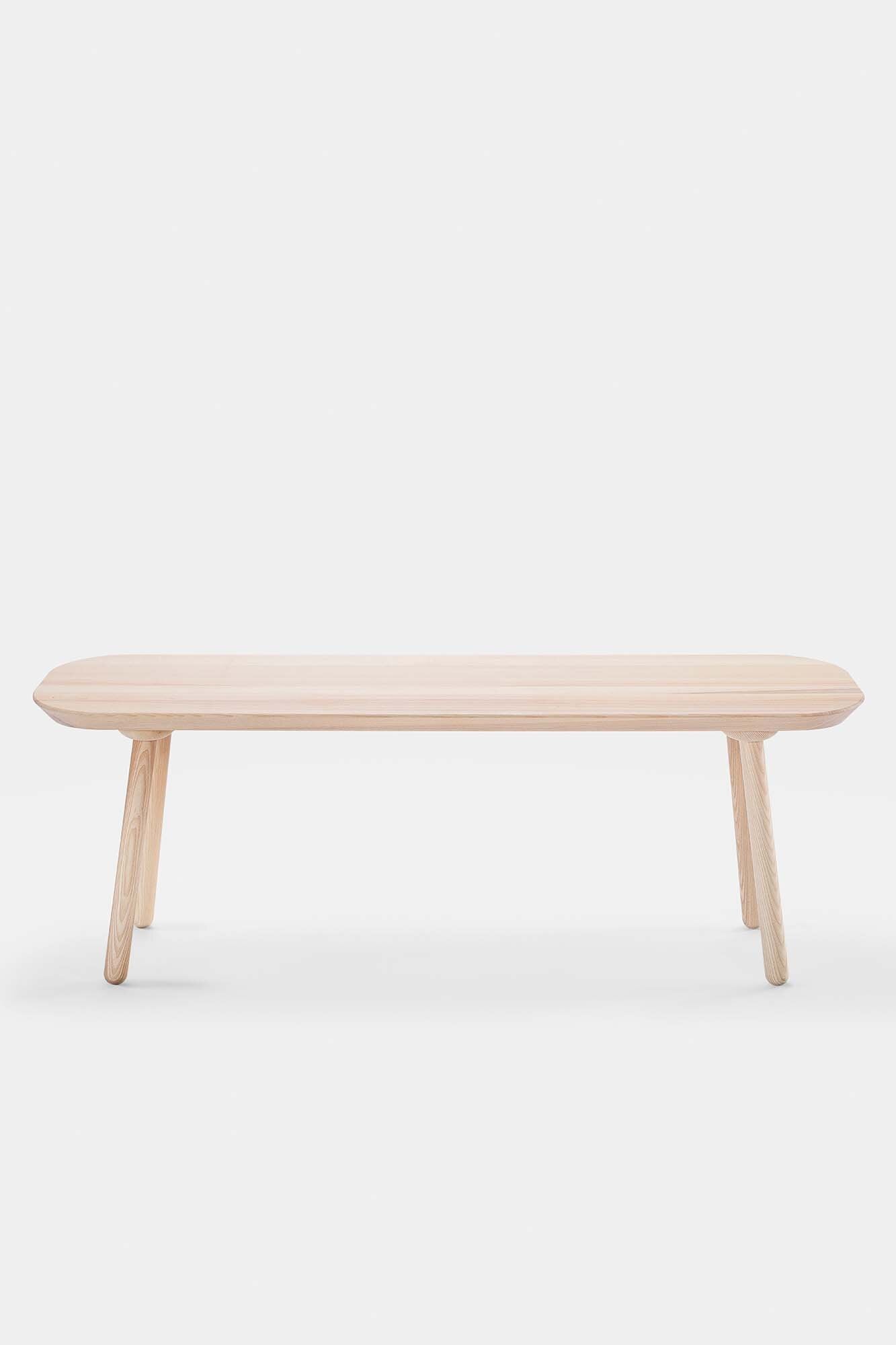 Naïve Bench made from solid wood, showcasing its elegant design and available in padded and unpadded options.