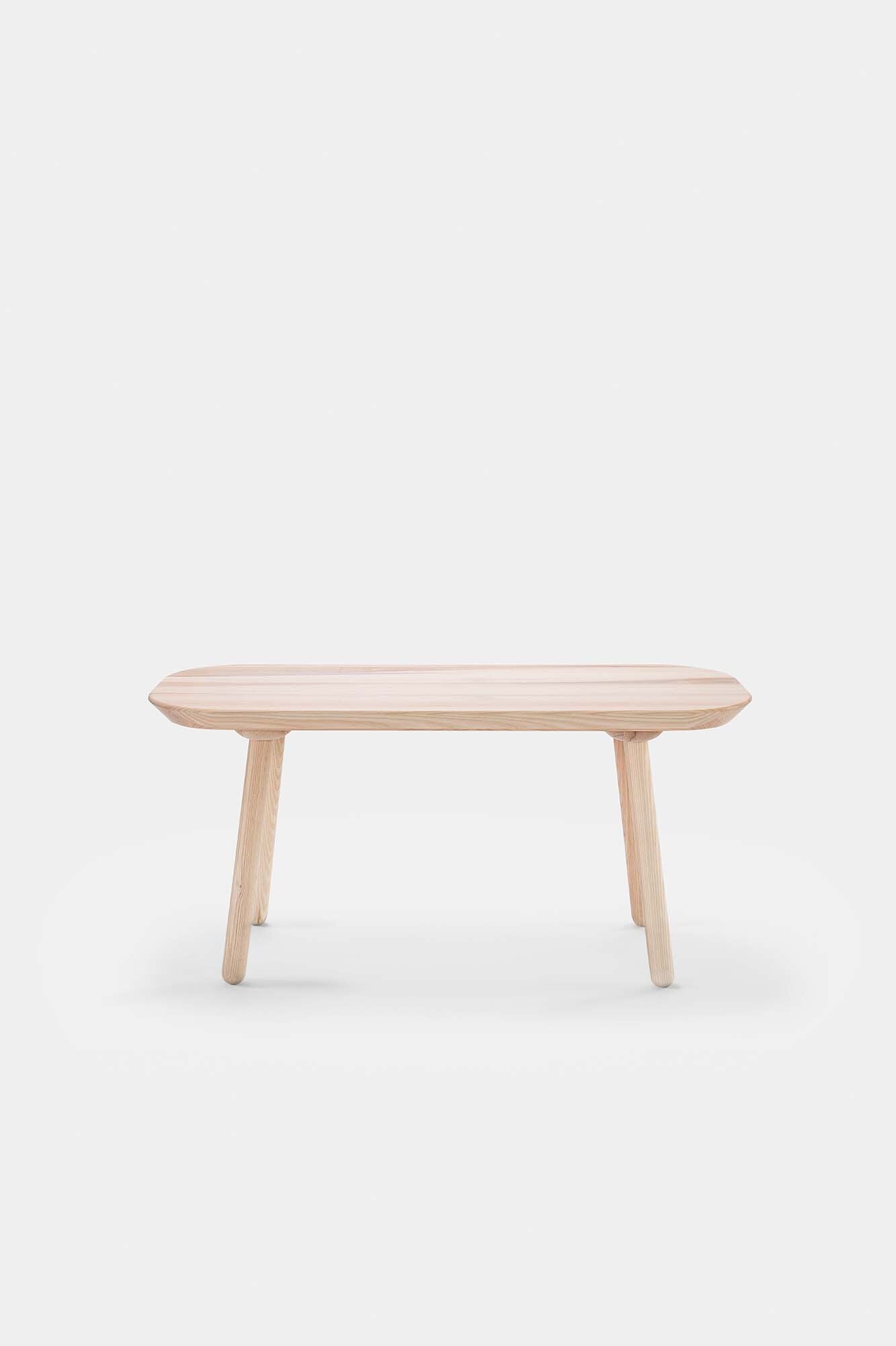 Naïve Bench made from solid wood, showcasing its elegant design and available in padded and unpadded options.