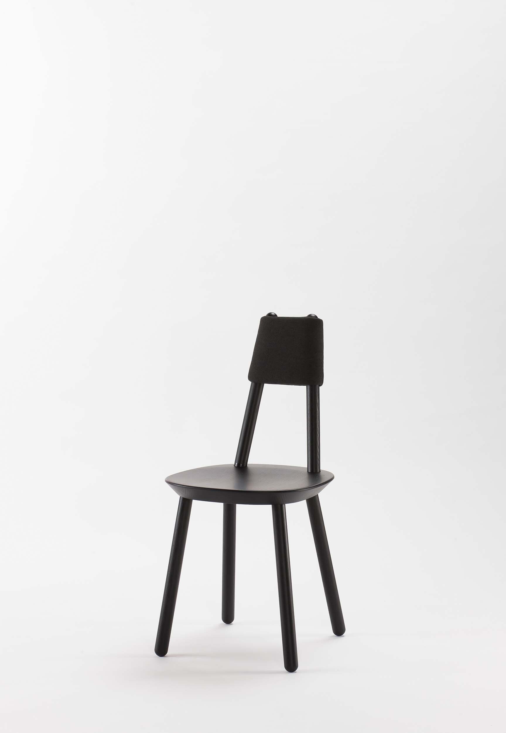 Naïve Dining Chair featuring a minimalist design with a solid ash seat and six equal-length legs, showcasing its playful and ergonomic structure.