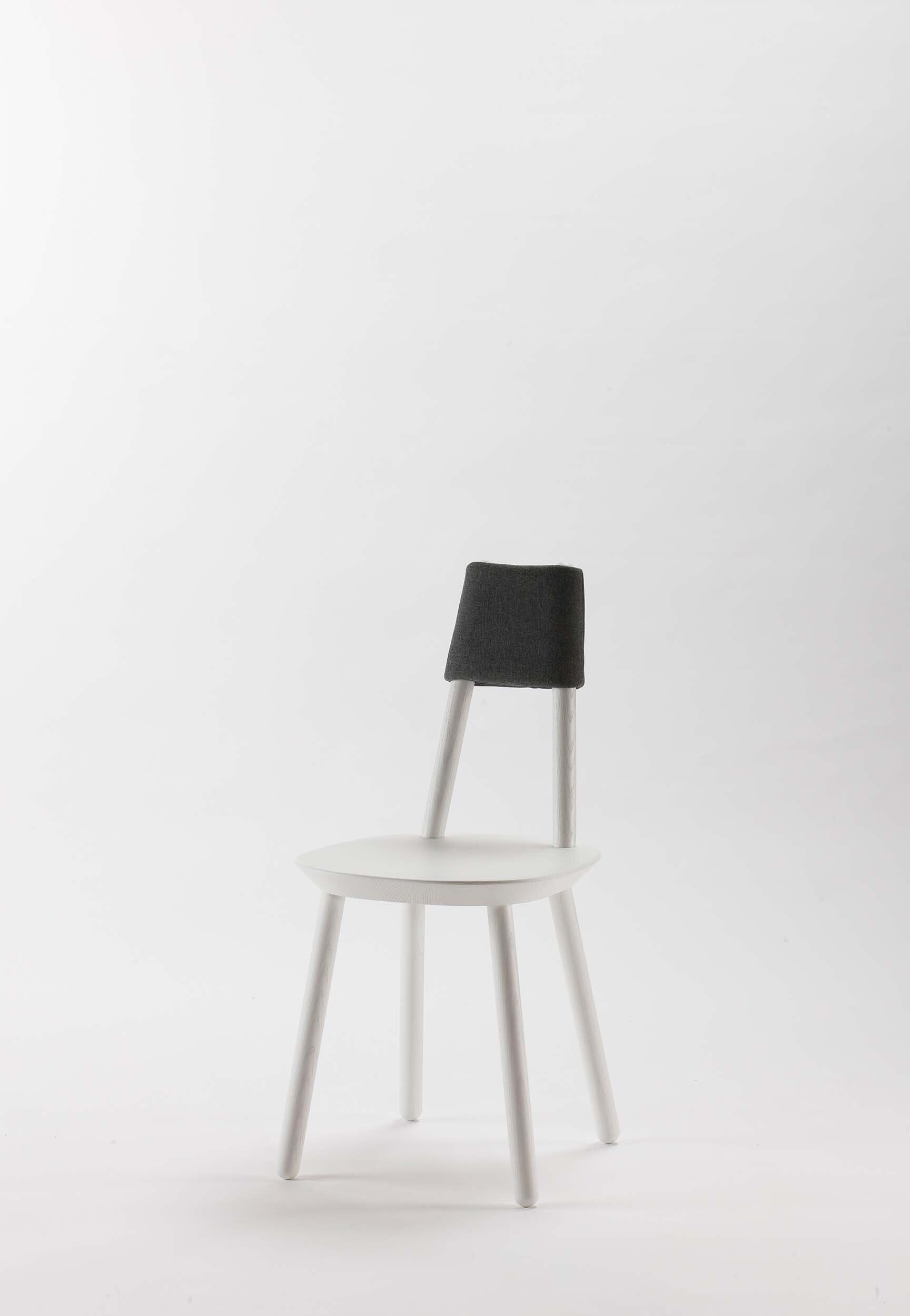 Naïve Dining Chair featuring a minimalist design with a solid ash seat and six equal-length legs, showcasing its playful and ergonomic structure.