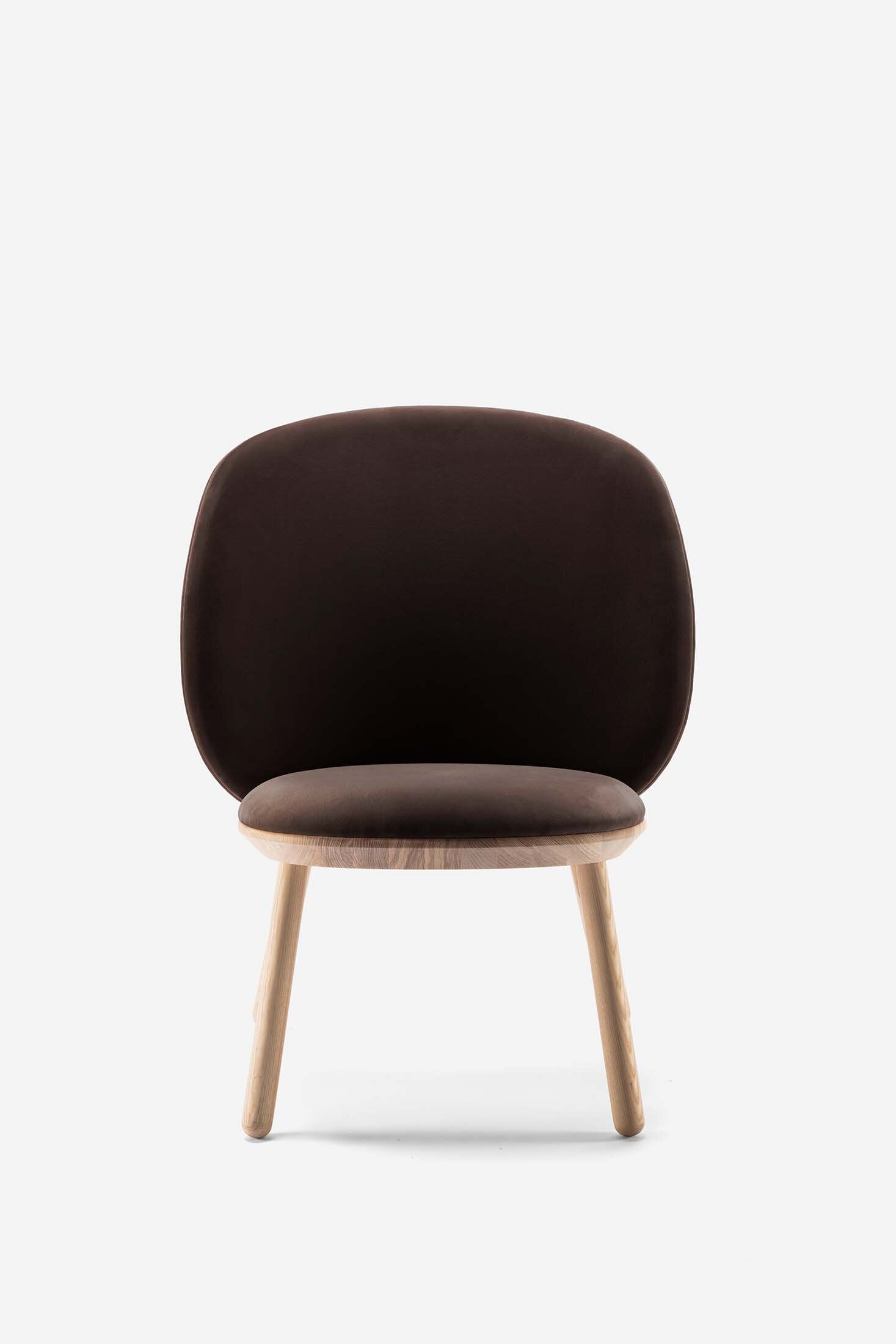 Naïve Low Chair featuring a large leather strap, wooden body, and textile upholstery, designed for comfort and style.