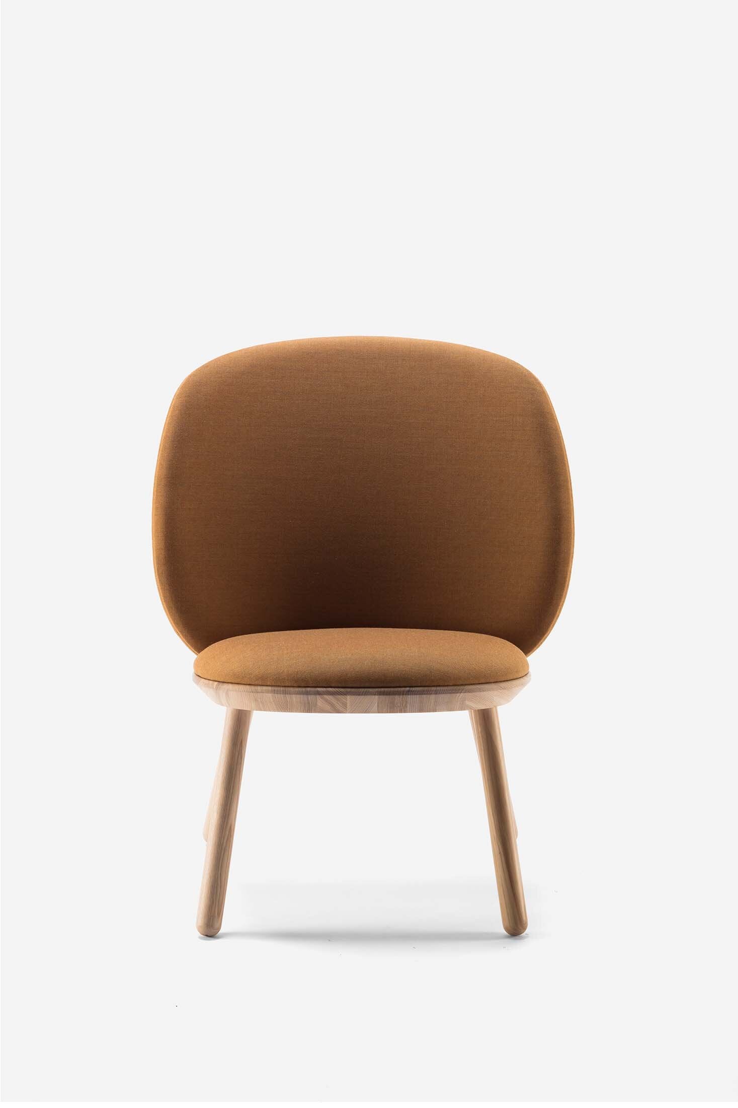 Naïve Low Chair featuring a large leather strap, wooden body, and textile upholstery, designed for comfort and style.