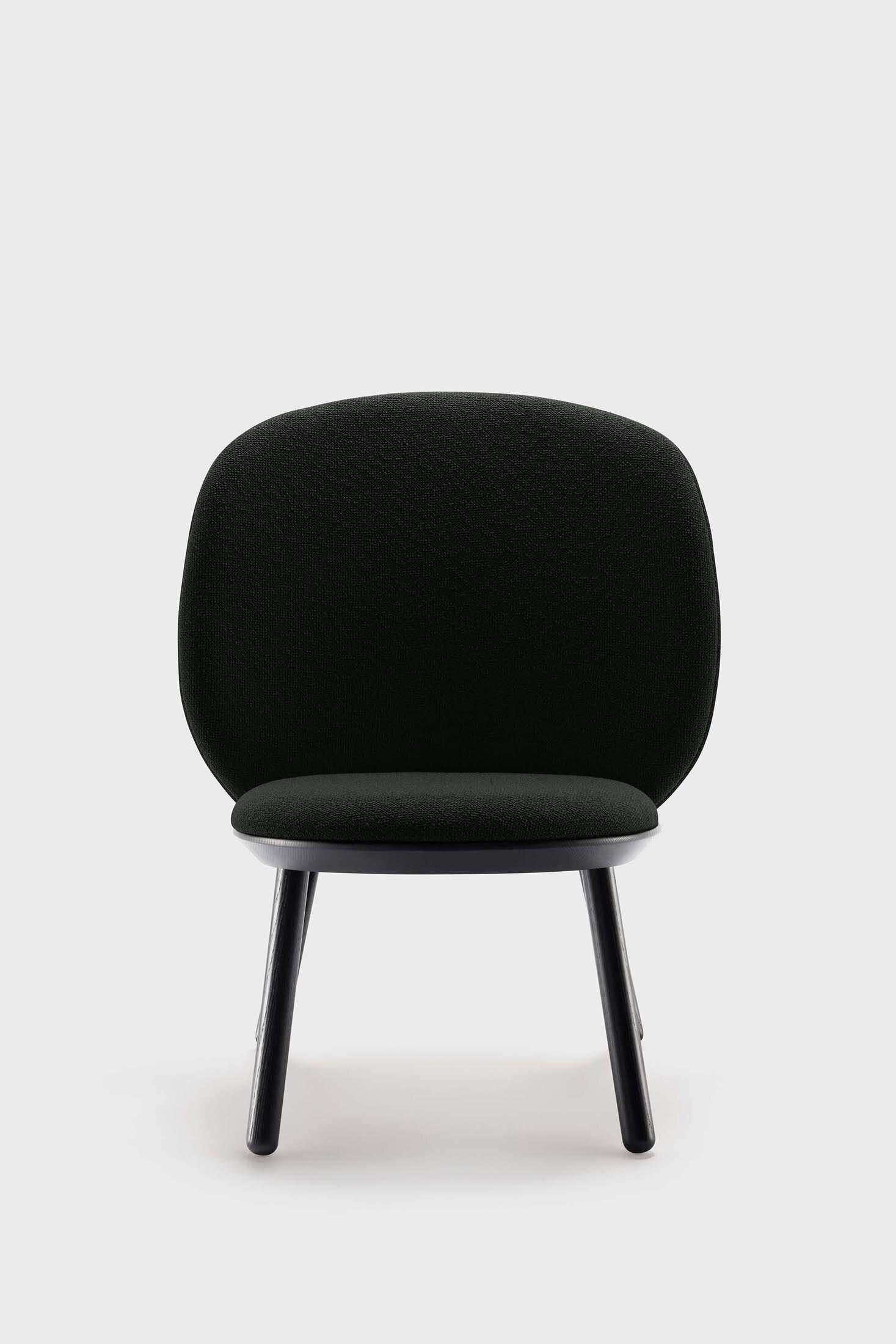 Naïve Low Chair featuring a large leather strap, wooden body, and textile upholstery, designed for comfort and style.