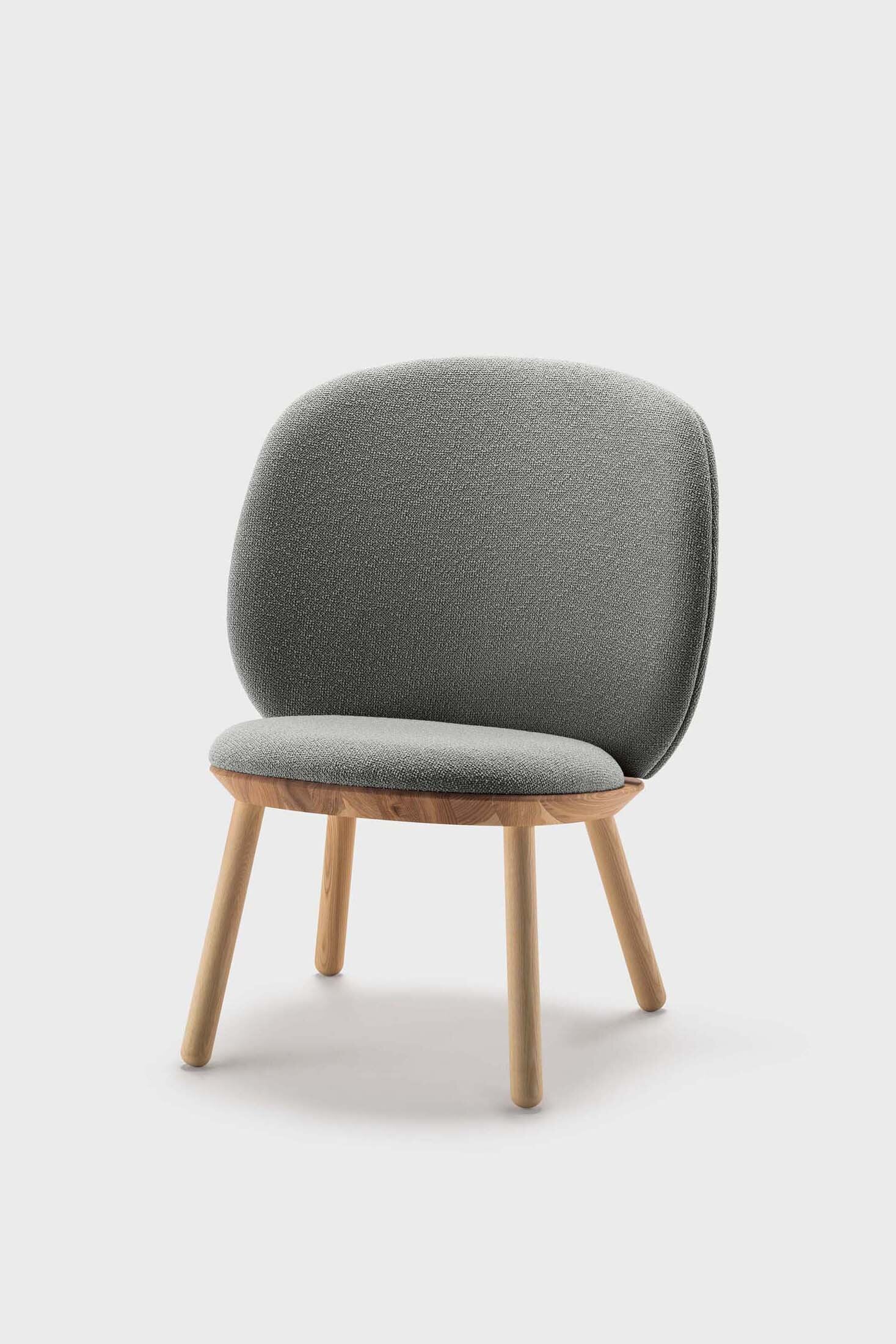 Naïve Low Chair featuring a large leather strap, wooden body, and textile upholstery, designed for comfort and style.