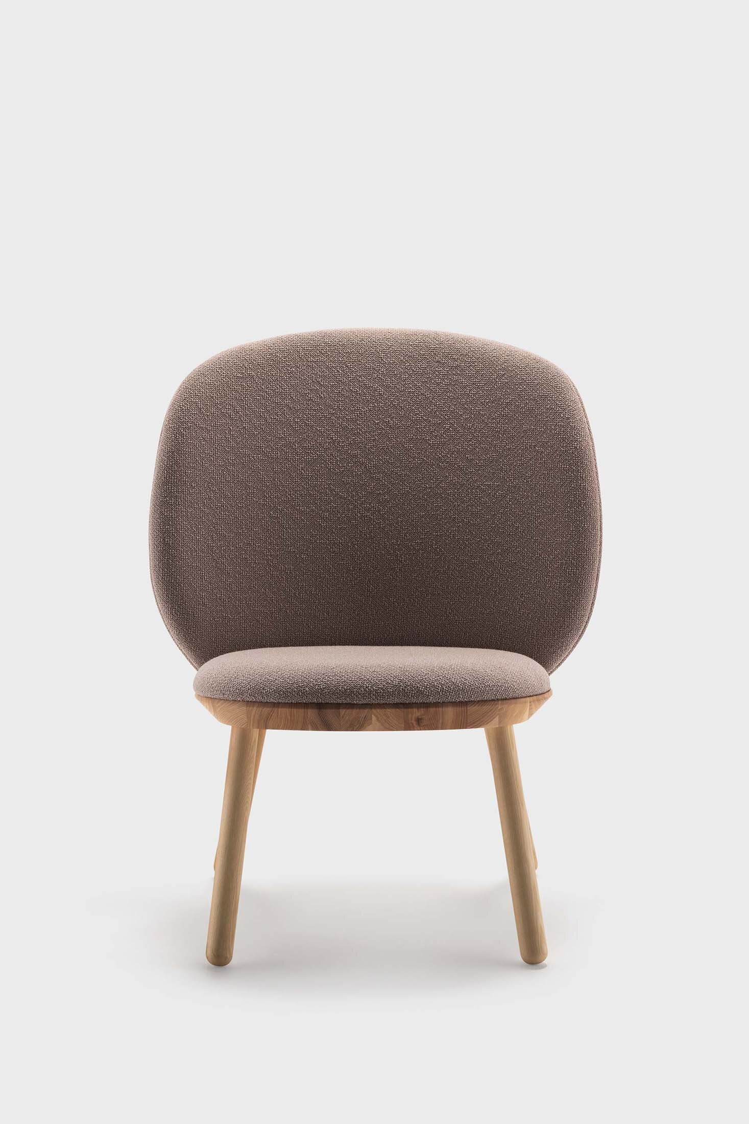 Naïve Low Chair featuring a large leather strap, wooden body, and textile upholstery, designed for comfort and style.