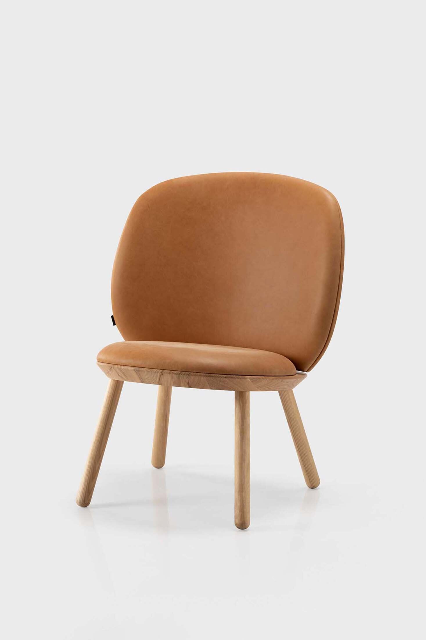 Naïve Low Chair featuring a large leather strap, wooden body, and textile upholstery, designed for comfort and style.