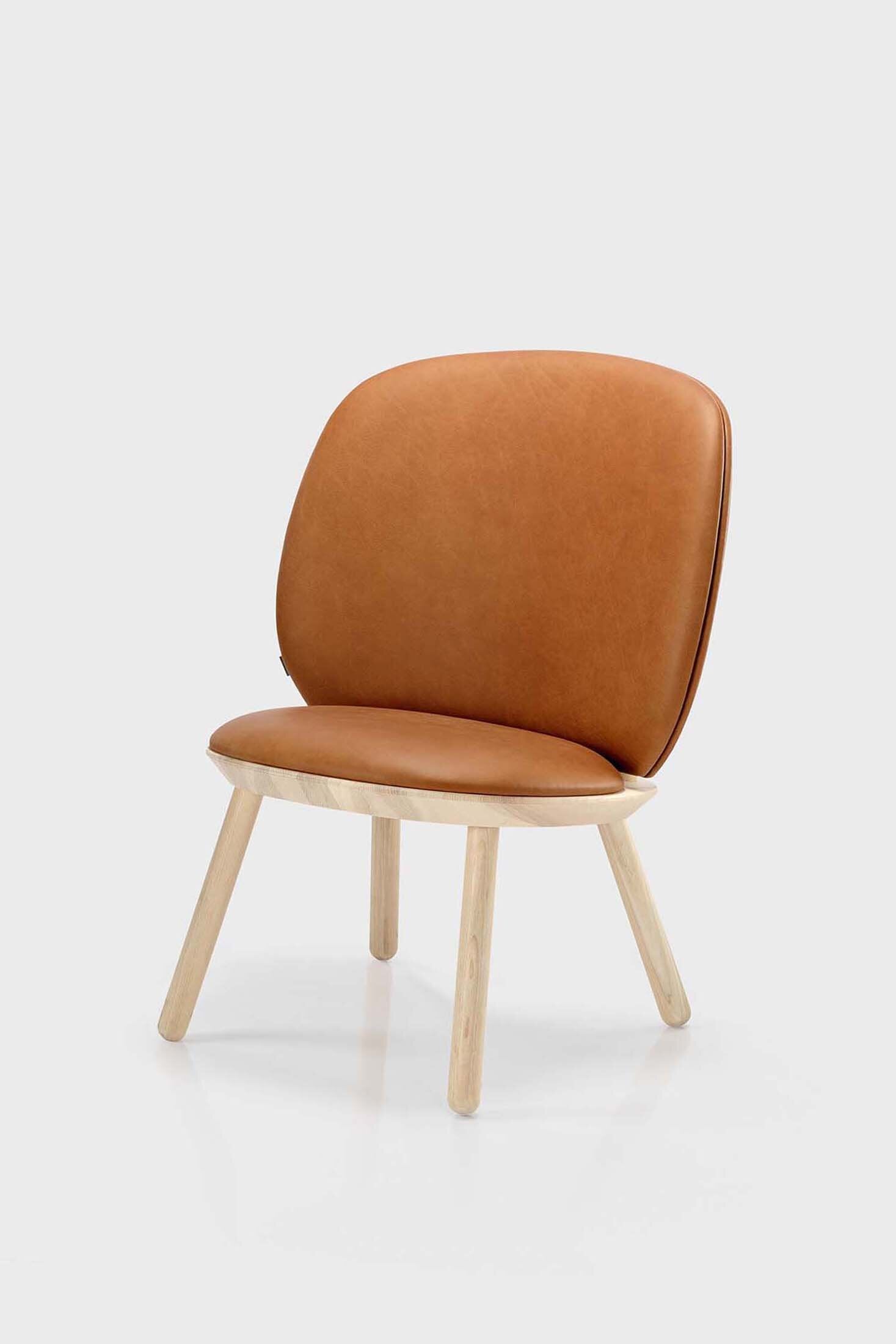 Naïve Low Chair featuring a large leather strap, wooden body, and textile upholstery, designed for comfort and style.