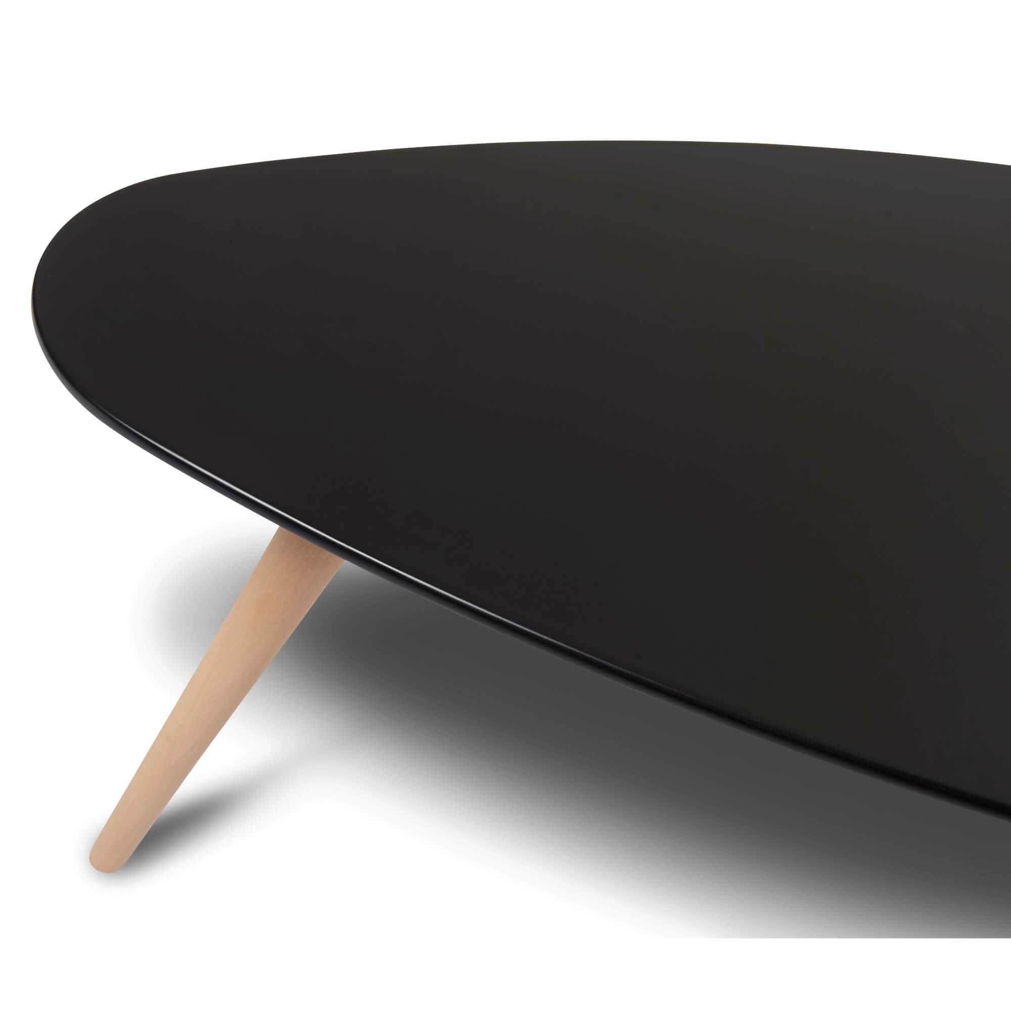 Elegant oval black coffee table made of beech wood and MDF, showcasing Scandinavian design, perfect for modern interiors.