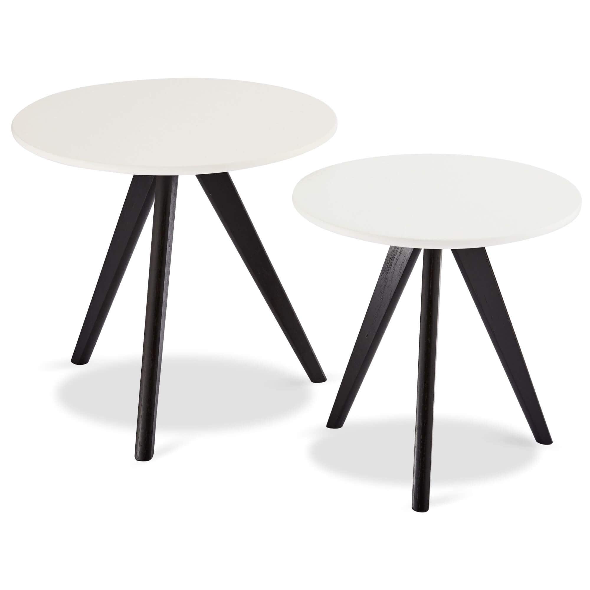 Round white and black coffee table with lacquered oak legs, stylish and modern design, perfect for coffee breaks.