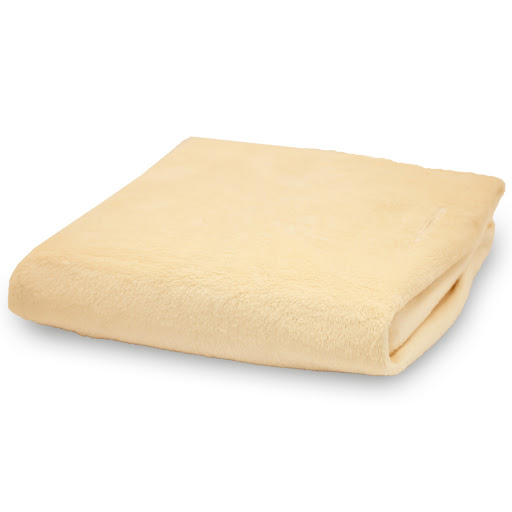 Folded beige blanket on display.