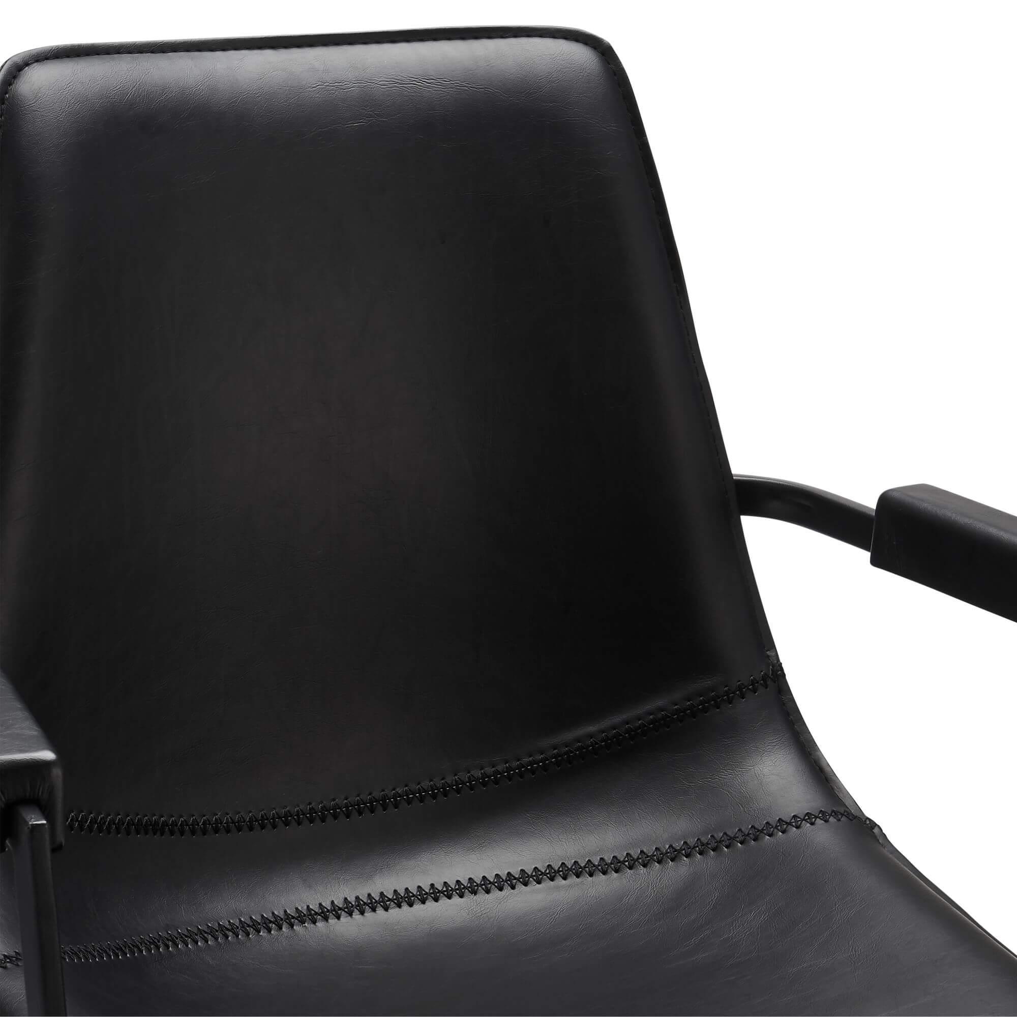 Set of 2 elegant black dining chairs with armrests, featuring soft faux leather upholstery and a modern design.