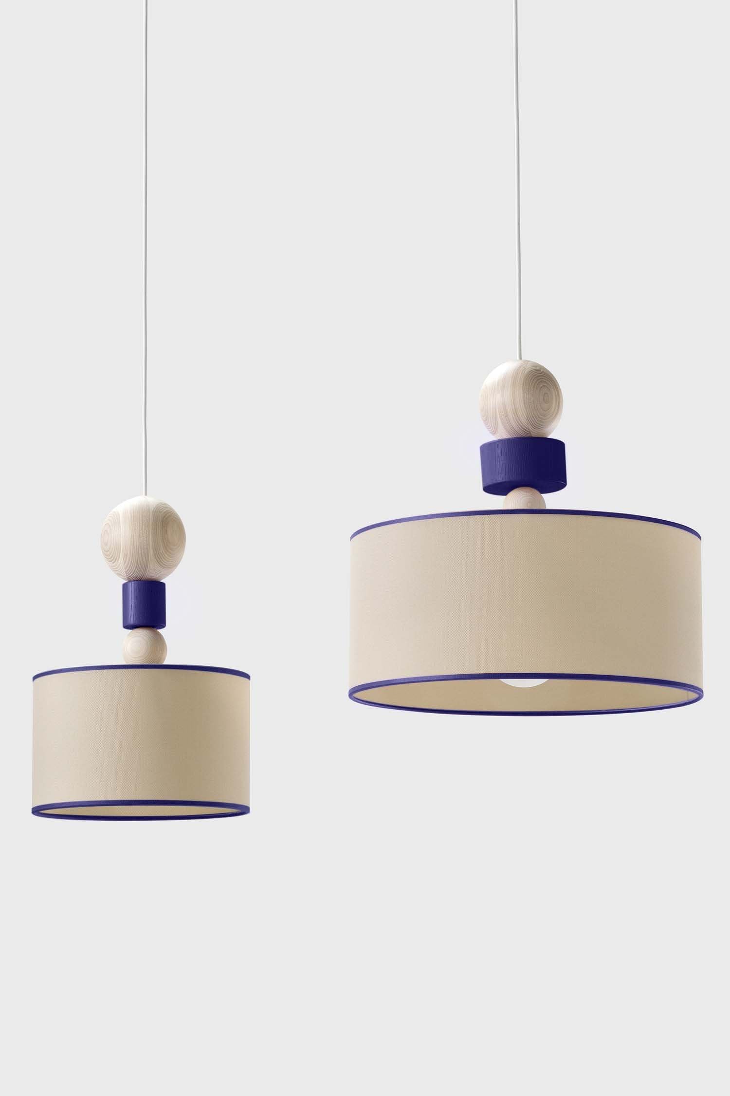 Spiedino Pendant Lamp featuring elegant design with solid ash and fabric elements, showcasing its Italian craftsmanship and sustainable materials.