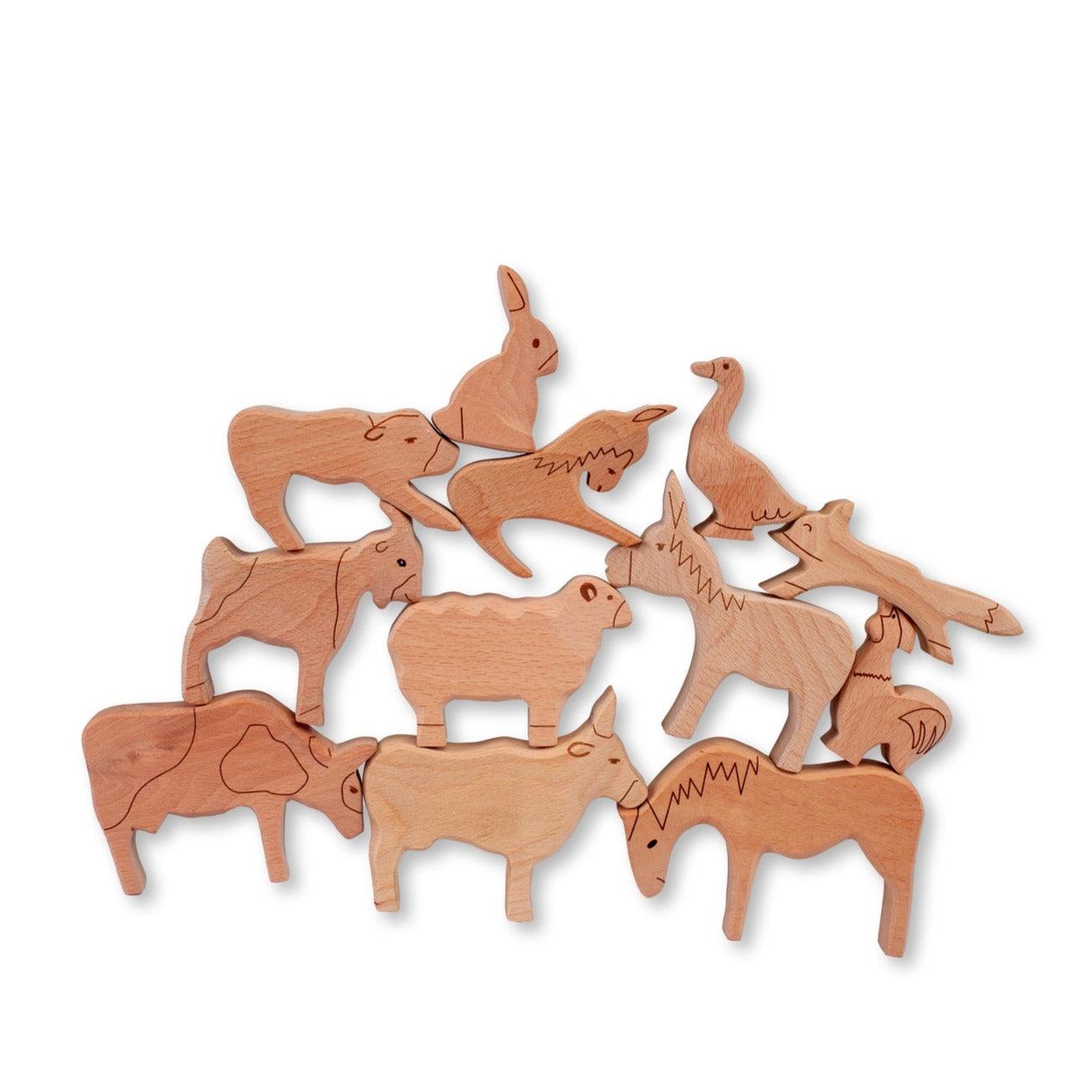 A colorful Wooden Farm Animals Set featuring intricately designed figures of cows, horses, pigs, ducks, and chickens, perfect for children's imaginative play.