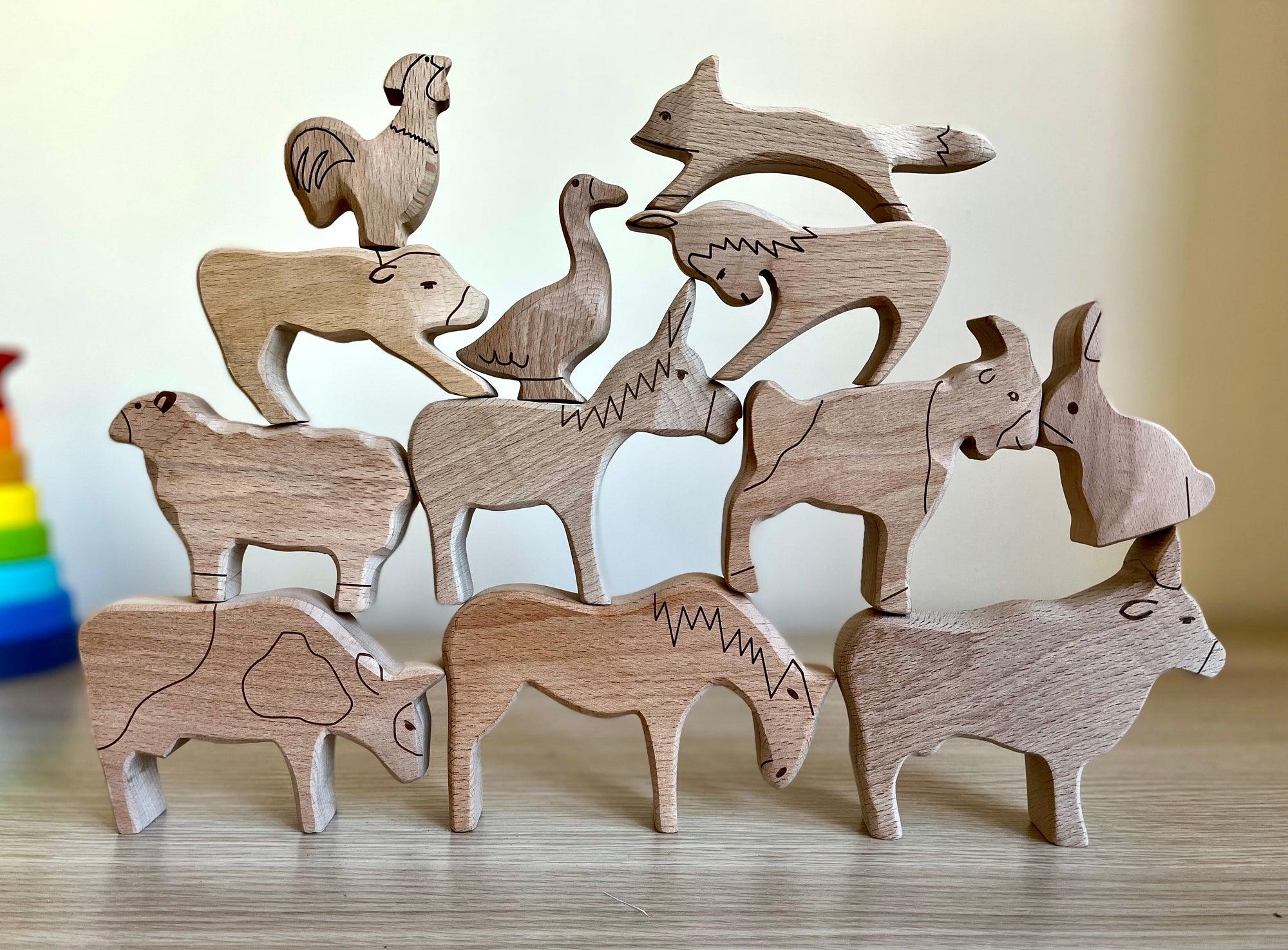 A colorful Wooden Farm Animals Set featuring intricately designed figures of cows, horses, pigs, ducks, and chickens, perfect for children's imaginative play.