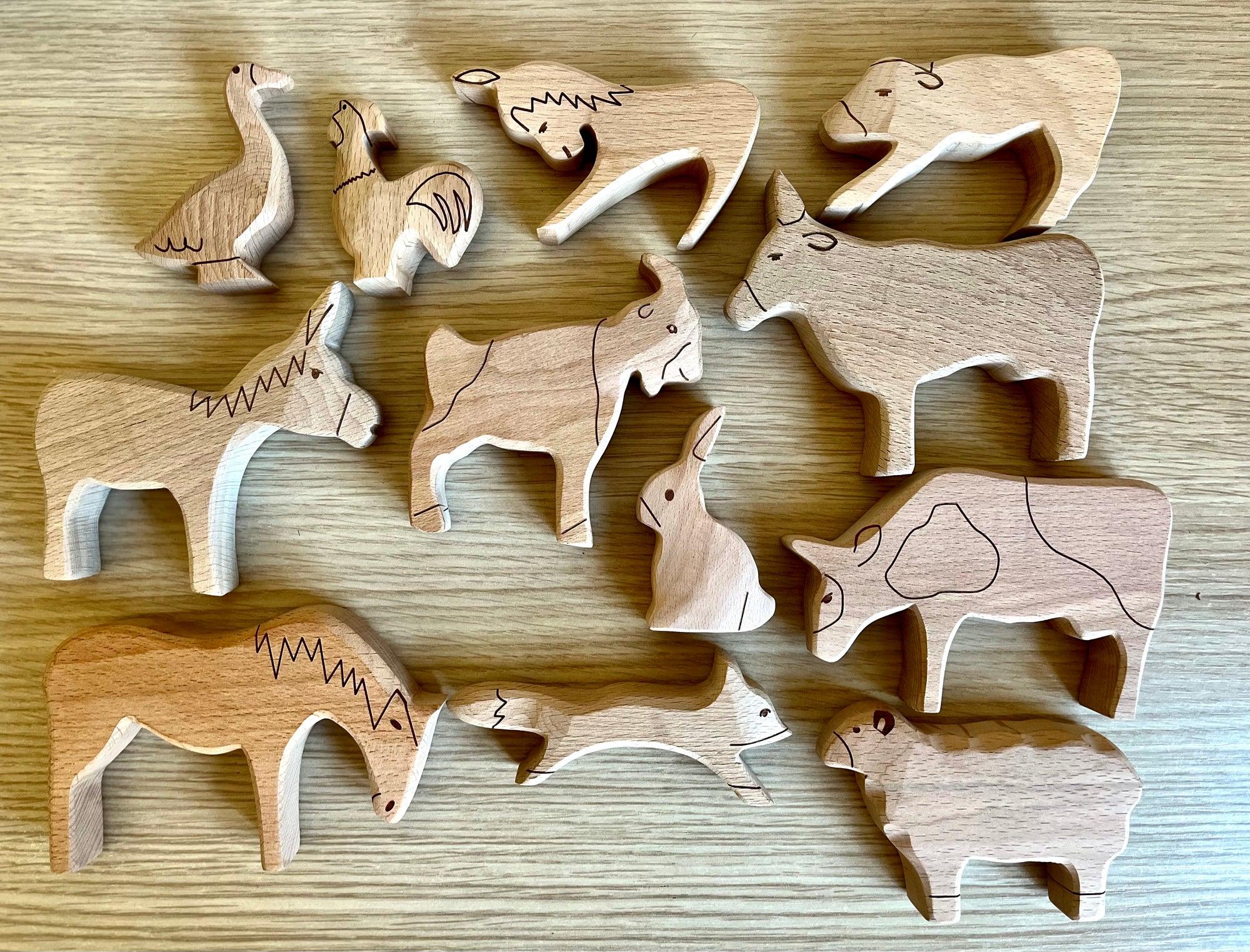 A colorful Wooden Farm Animals Set featuring intricately designed figures of cows, horses, pigs, ducks, and chickens, perfect for children's imaginative play.