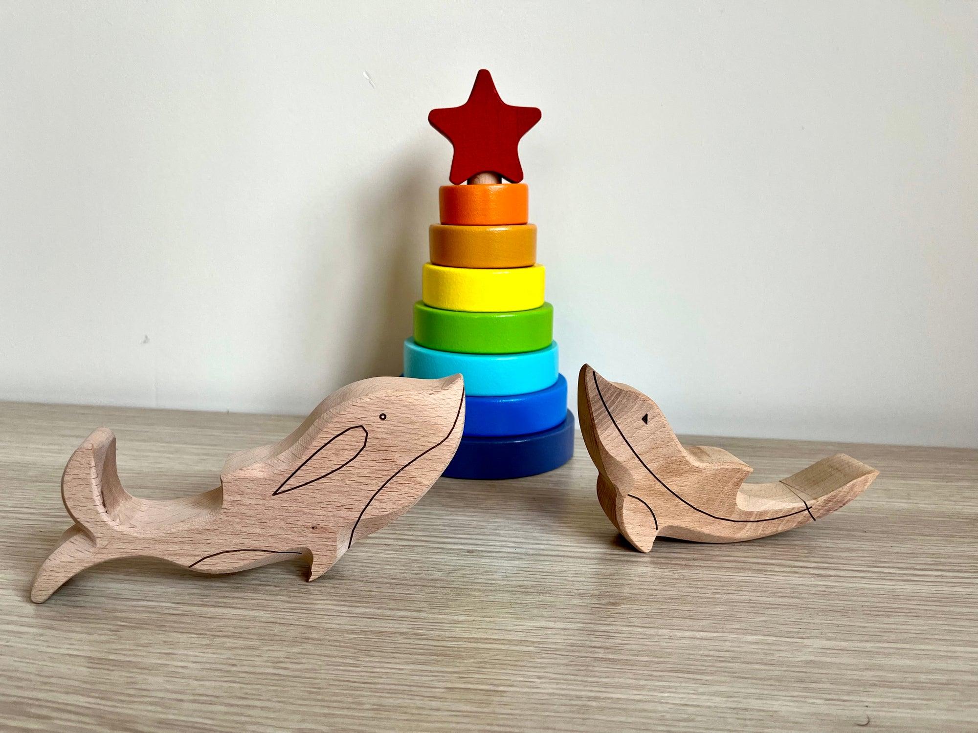 A colorful Wooden Ocean Animals Set featuring a dolphin, whale, sea turtle, starfish, and clownfish, designed for children's play and education.