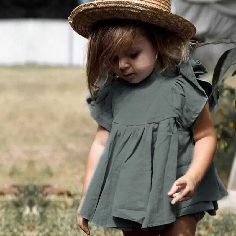 A stylish 2 pc set in vintage green featuring a flowing dress-like top with flutter sleeves and matching bloomer bottoms.